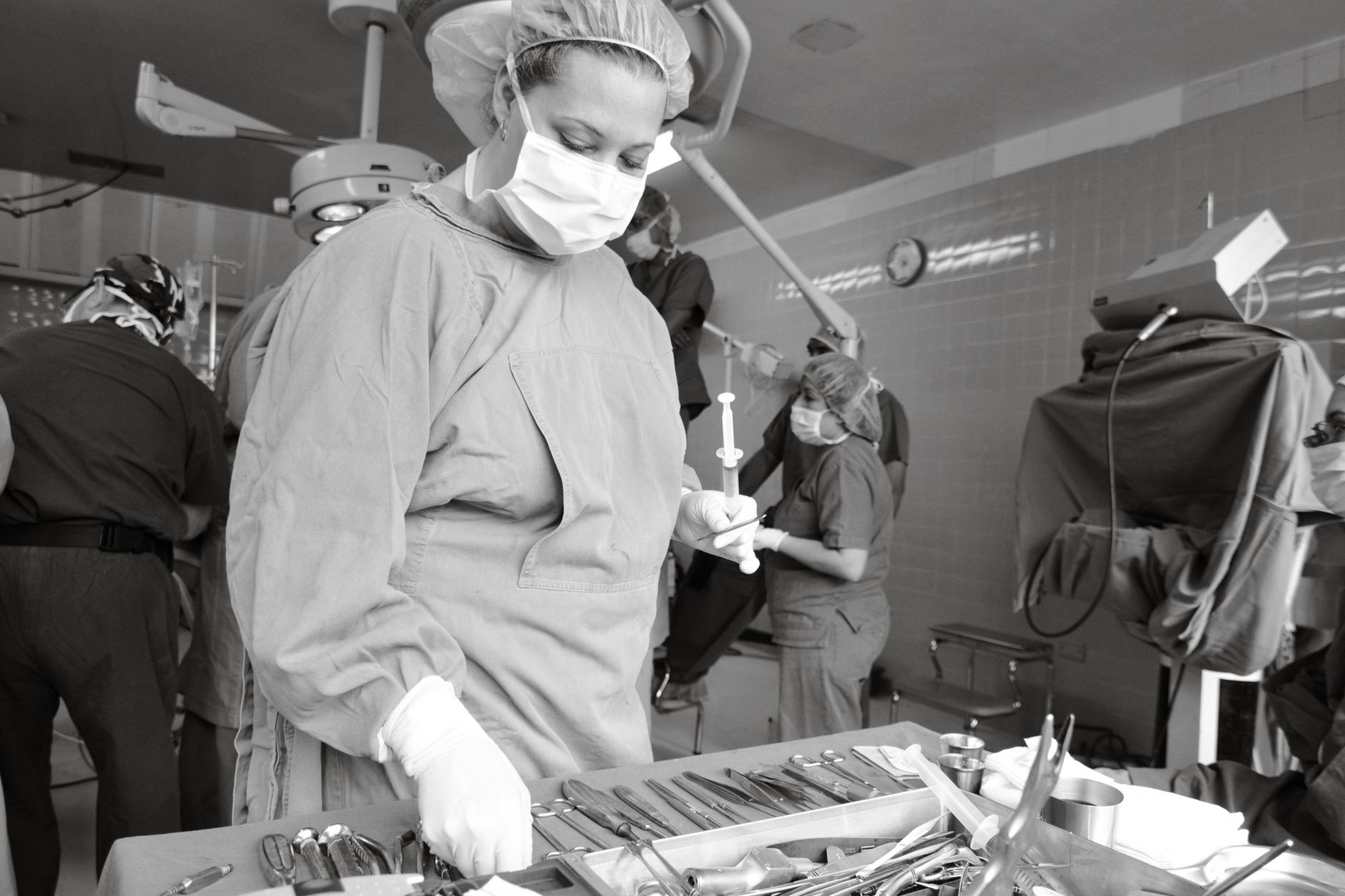 Surgical team in an operating room focused on a procedure, showcasing precision and teamwork.