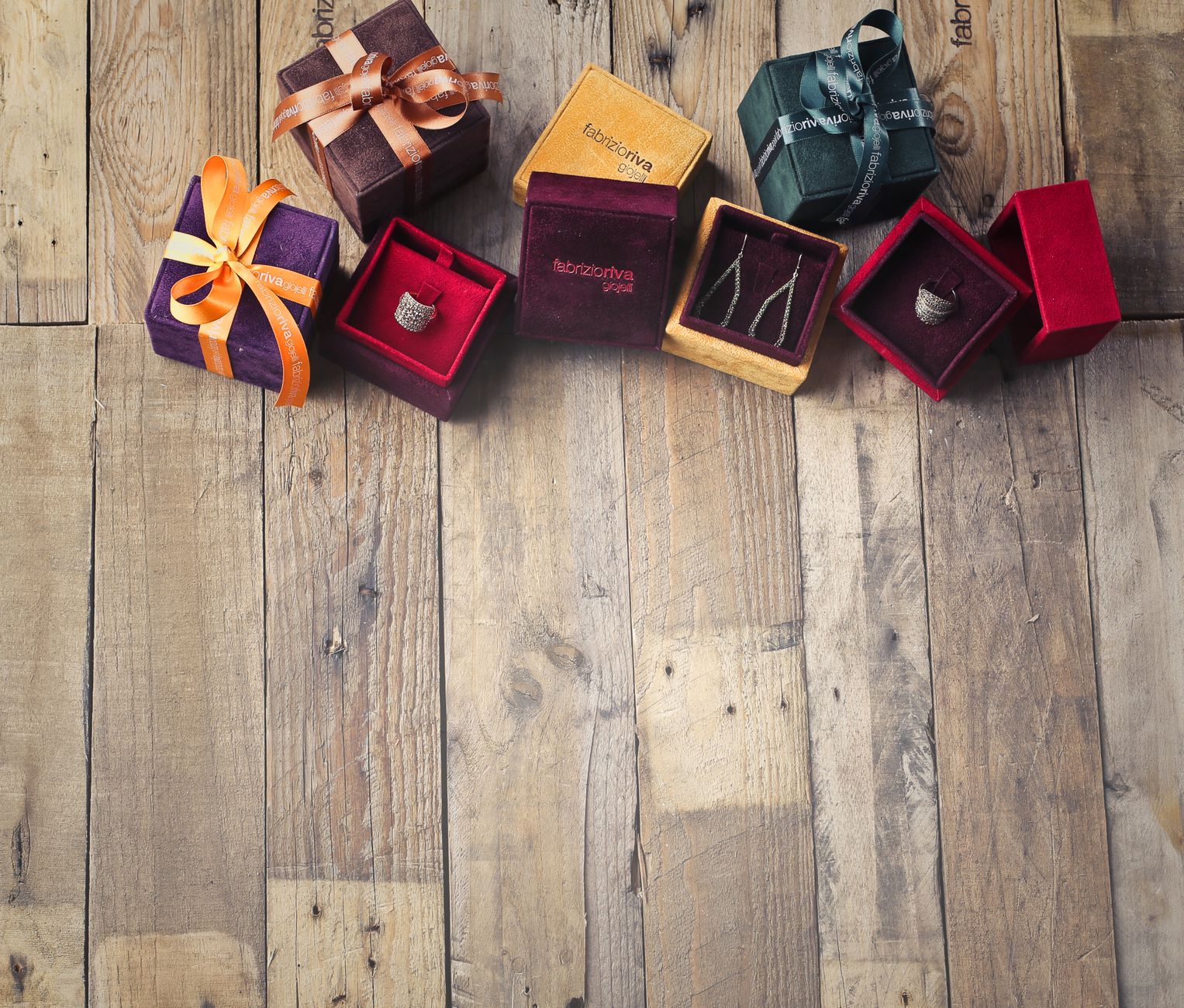 Brightly colored gift boxes on a rustic wooden background, perfect for celebrations.
