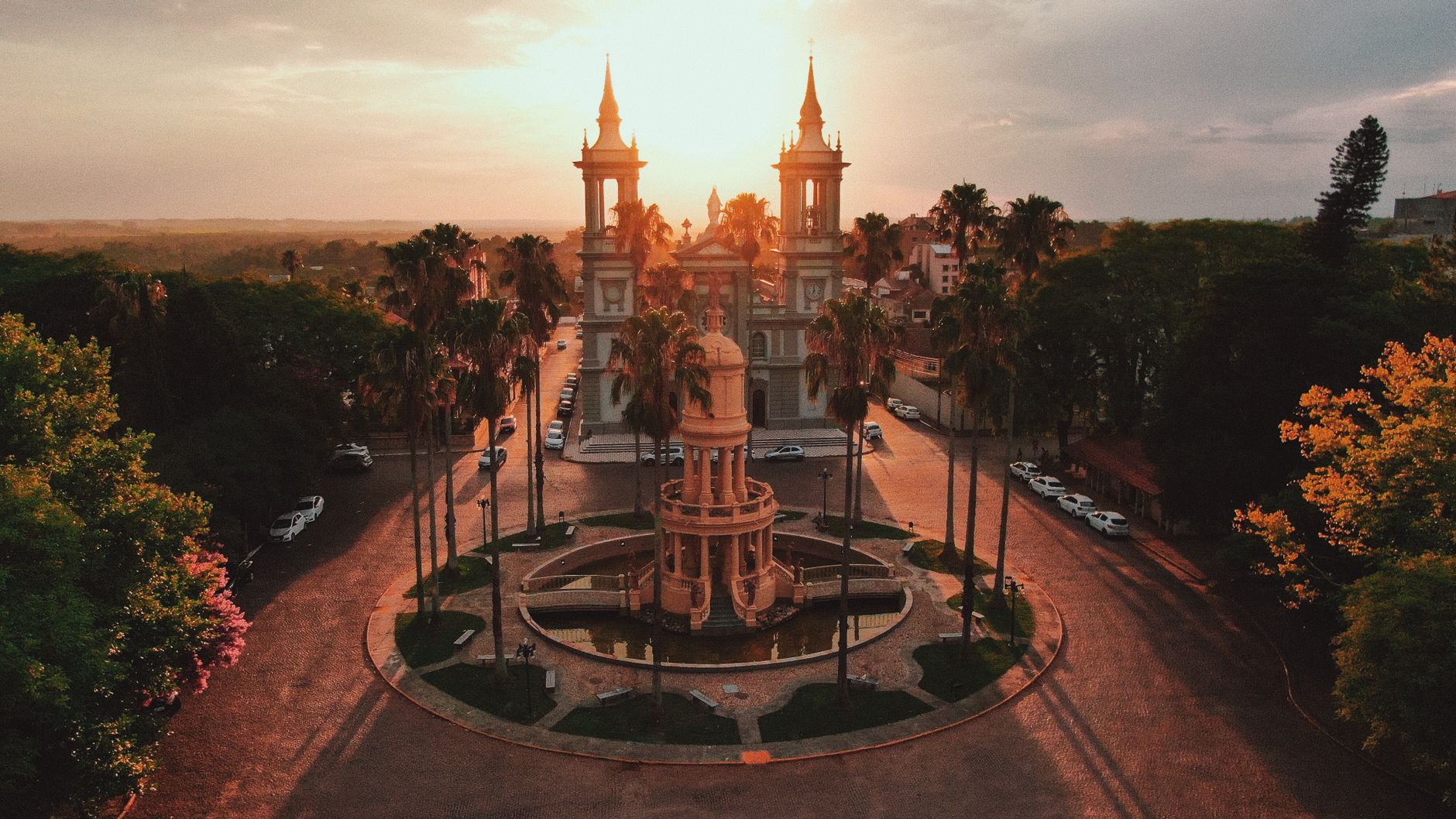 A stunning aerial view of the Basilica during sunset in Rio Grande do Sul, Brazil, capturing warm tones and architectural beauty.