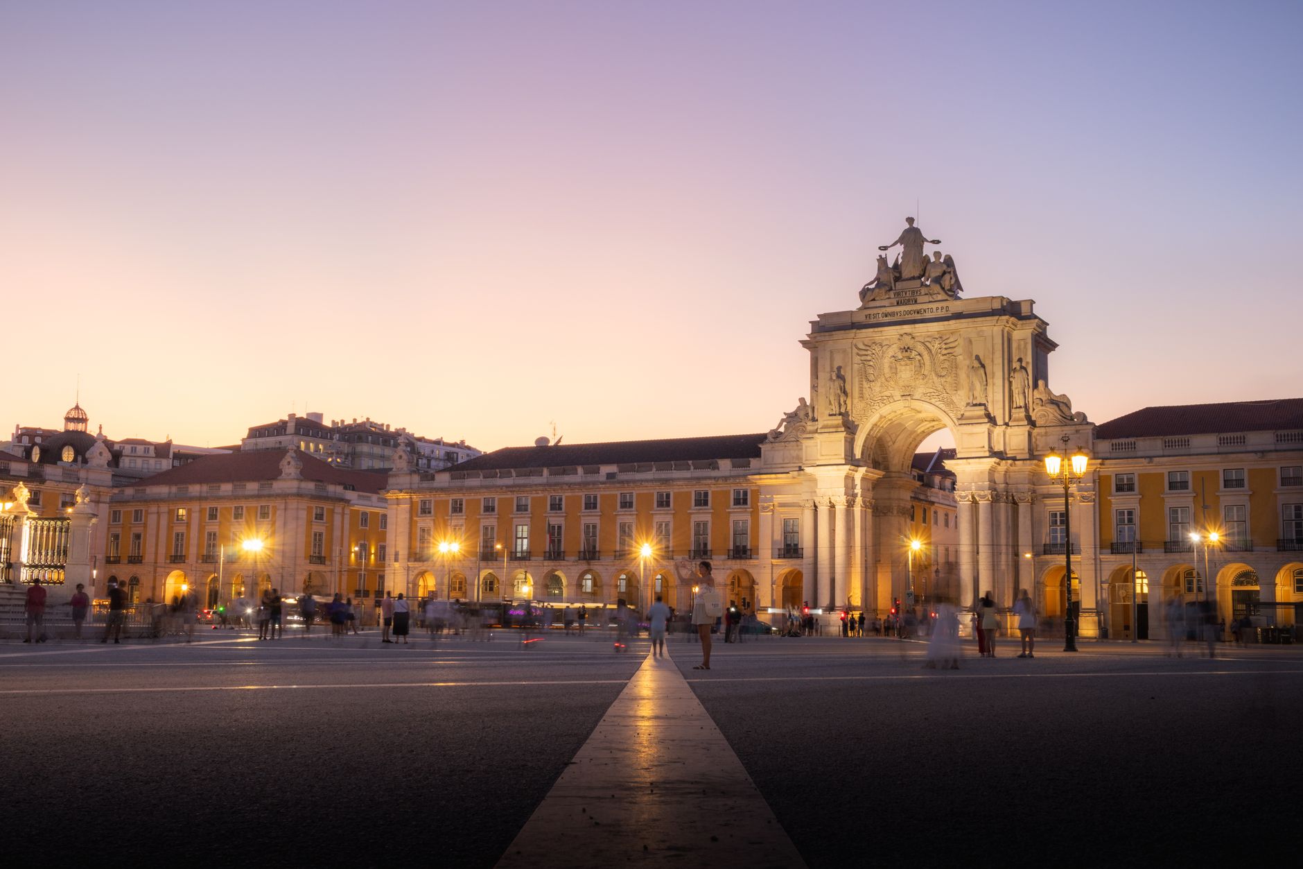 Elegant twilight scene of Arco da Rua Augusta in Lisbon, capturing its iconic architecture and ambient glow.