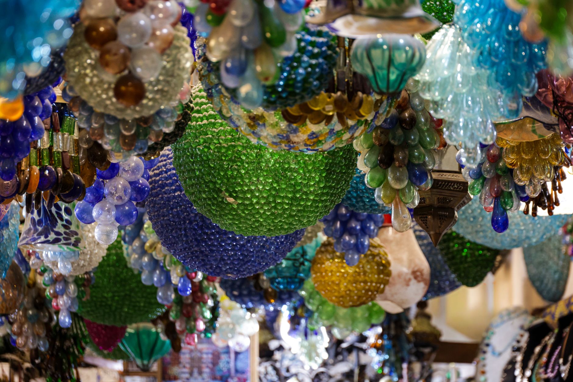 Colorful Murano glass chandeliers create a stunning decorative display.