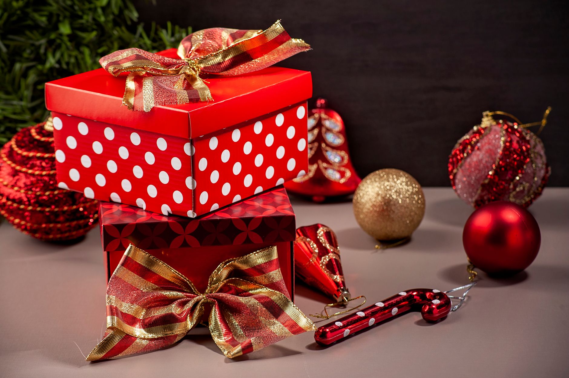 Festive holiday scene with gift boxes and Christmas ornaments.