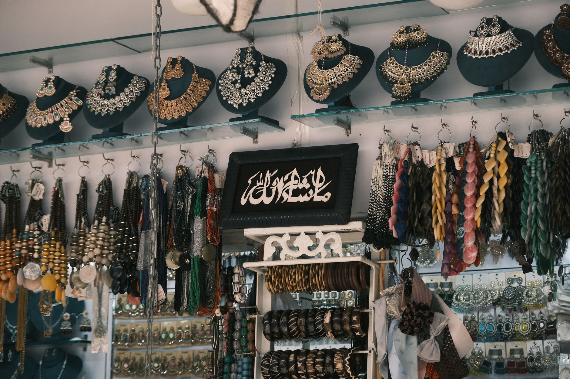 Elegant display of traditional jewelry in a boutique, showcasing vibrant colors and intricate designs.