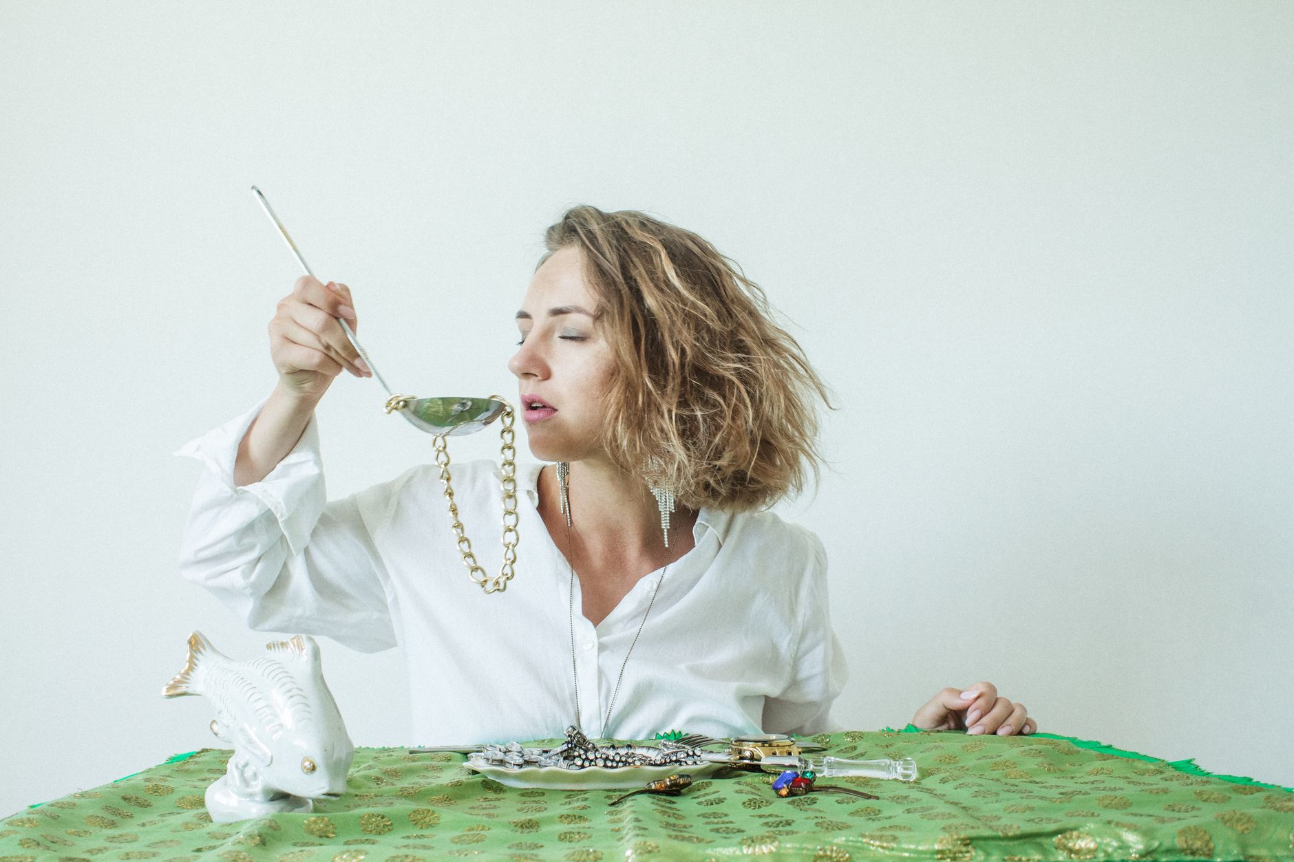 Creative image of a woman with jewelry, blending art and fashion.