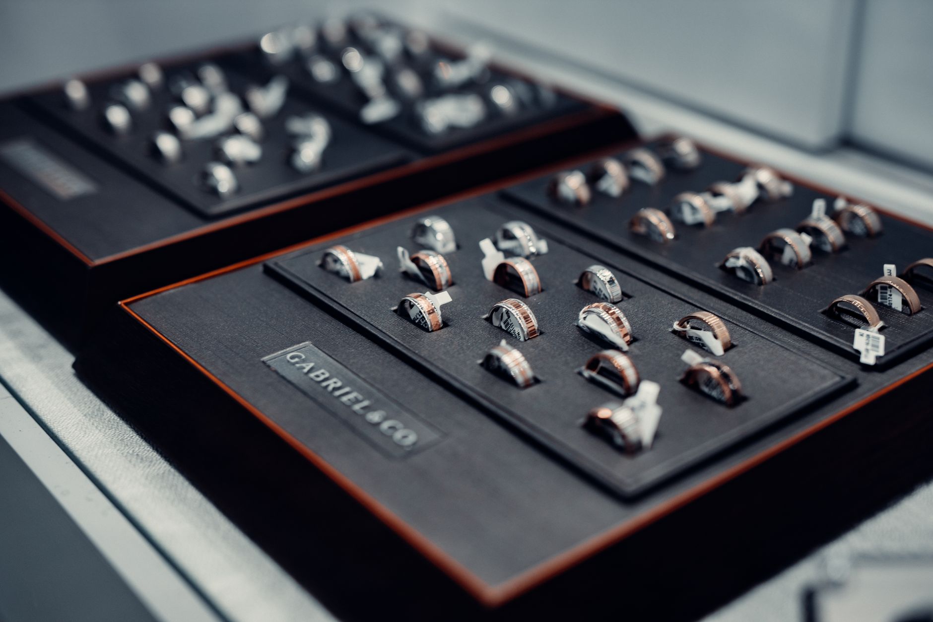 A collection of luxurious rings elegantly displayed on velvet trays, showcasing fine craftsmanship and design.
