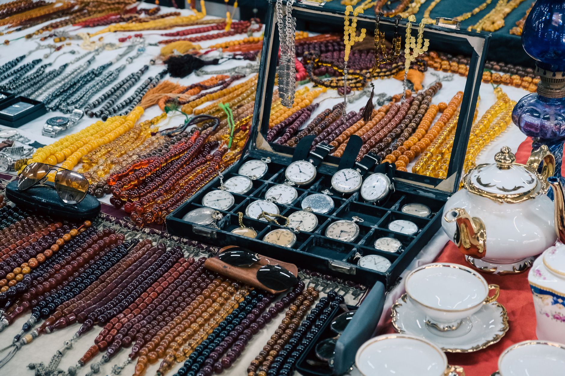 Colorful jewelry and watch display at a bustling Istanbul bazaar.