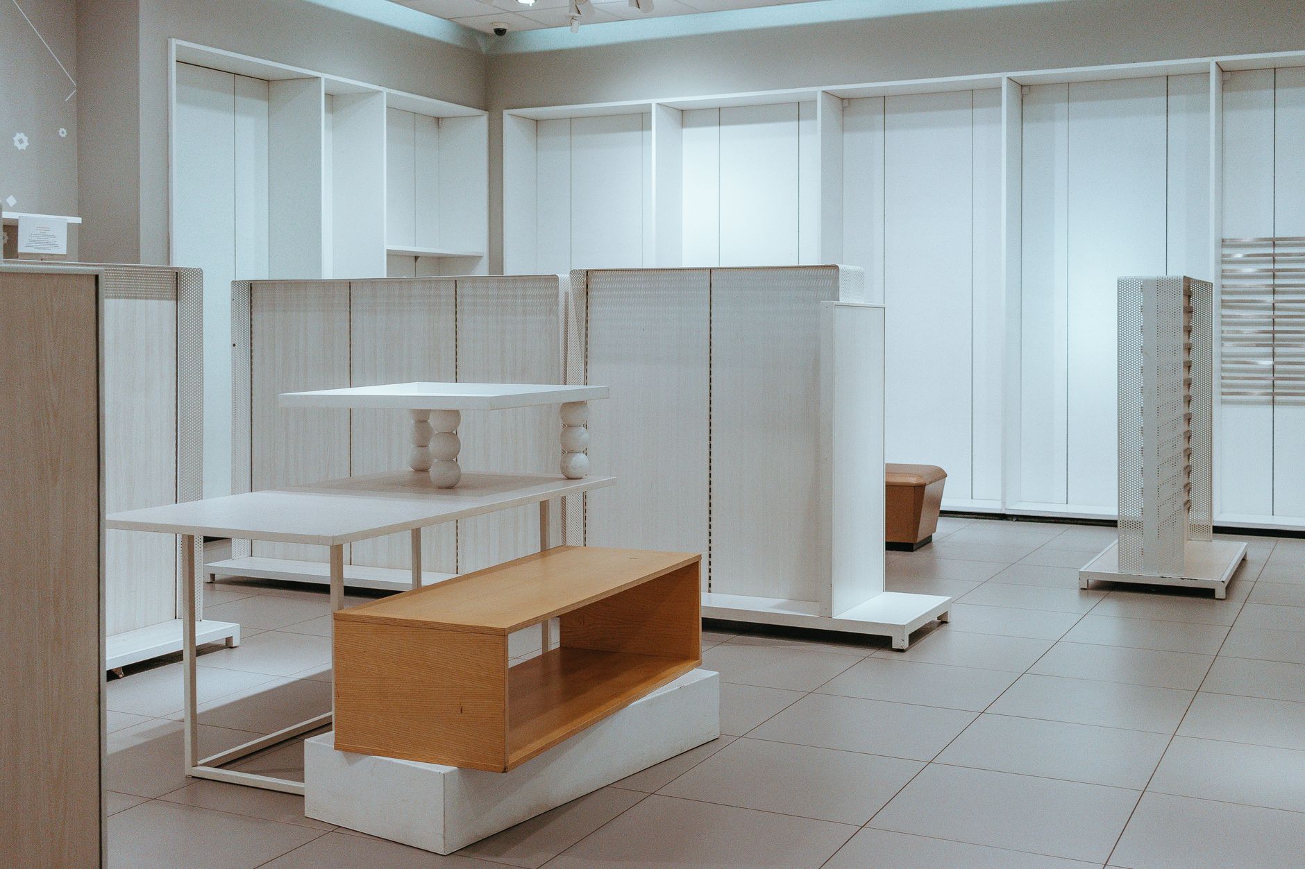Modern interior with minimalist white shelves and contemporary design elements.
