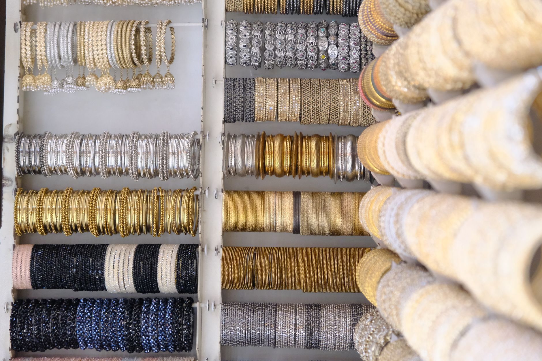 Colorful and intricate Indian bangles displayed in a shop in Bengaluru, India.