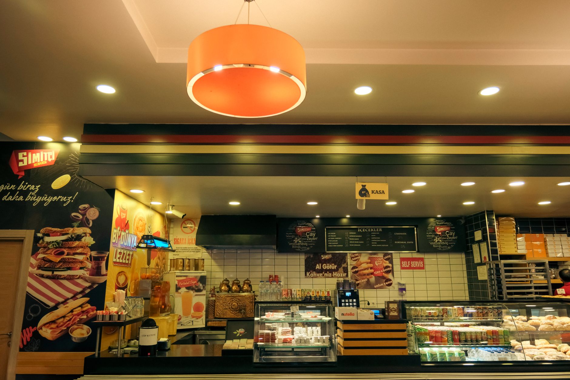 Cozy café interior with a variety of pastries and a warm, inviting atmosphere.