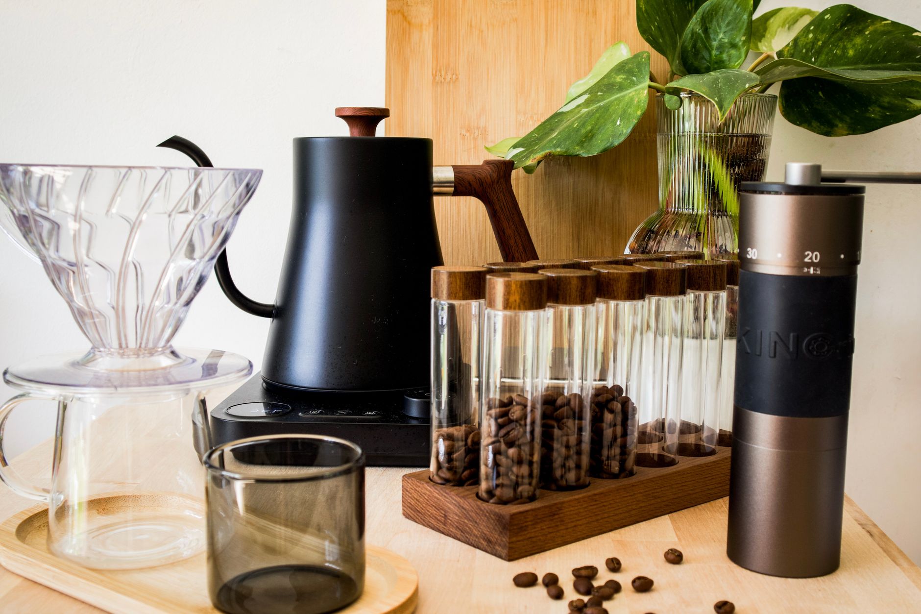 Stylish coffee brewing setup with kettle, grinder, and glassware. Perfect for home baristas.