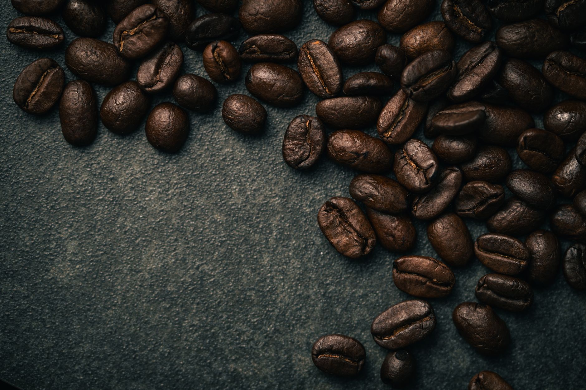 A detailed close-up of roasted coffee beans, ideal for coffee lovers and cafe themes.