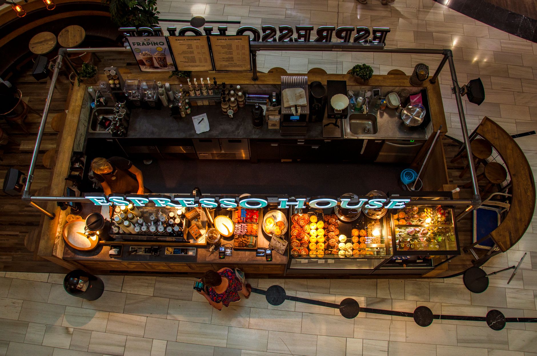 Overhead shot of Espresso House café with pastries and beverages, Stockholm mall.