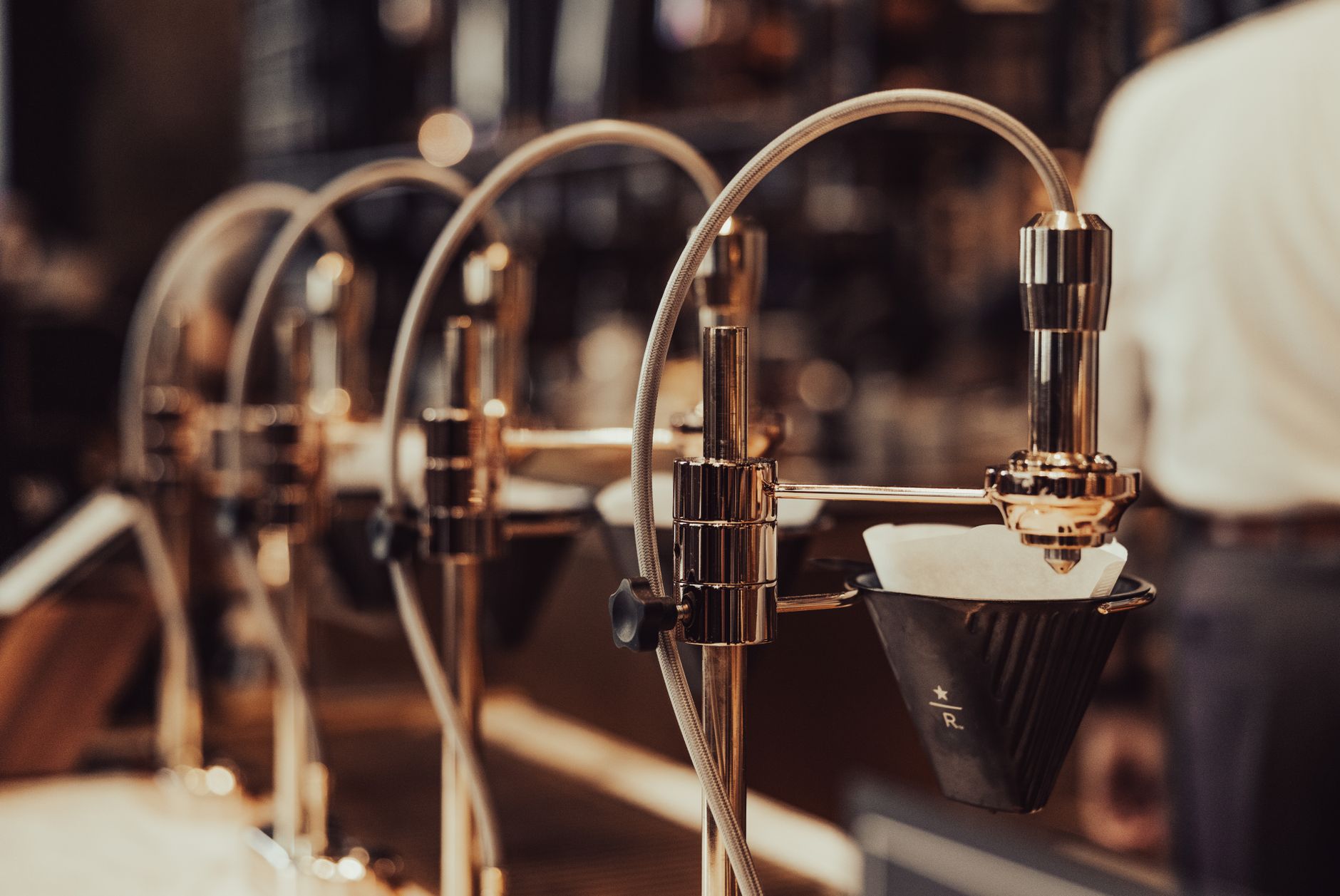 Close-up view of modern drip coffee equipment in a stylish cafe setting.