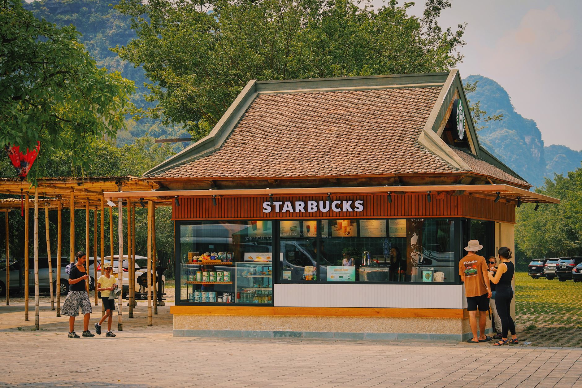 A unique Starbucks kiosk in traditional Vietnamese architecture located in scenic Ninh Binh.