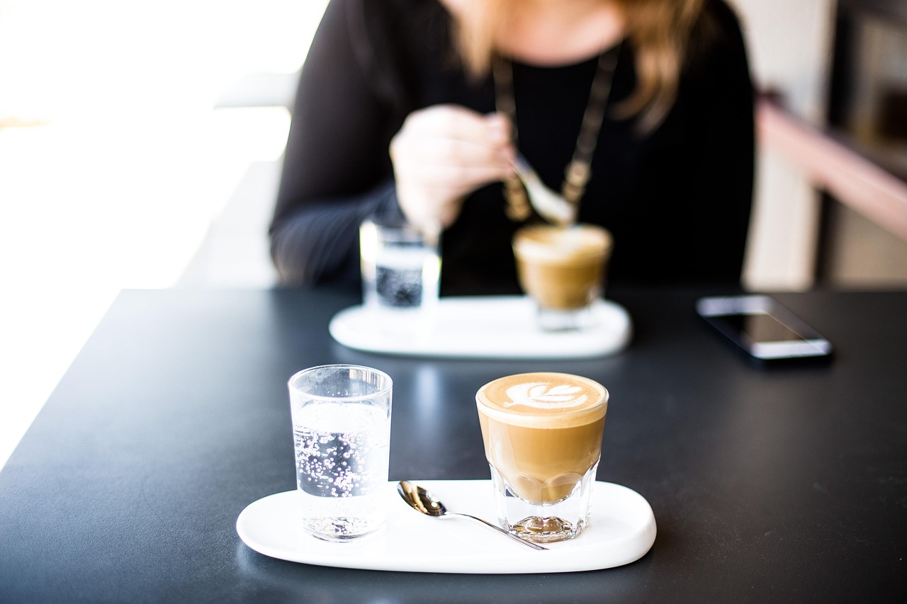 cafe, bar, restaurant, coffee, breakfast, cappuccino, cup, coffee cup, drink, glass, indoors, latte, person, plate, table