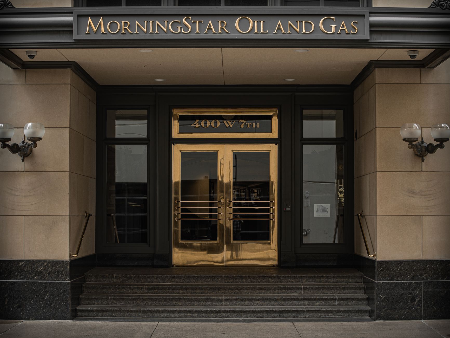 Entrance of MorningStar Oil and Gas at 400 W 7th, depicting a classic and formal architectural style.