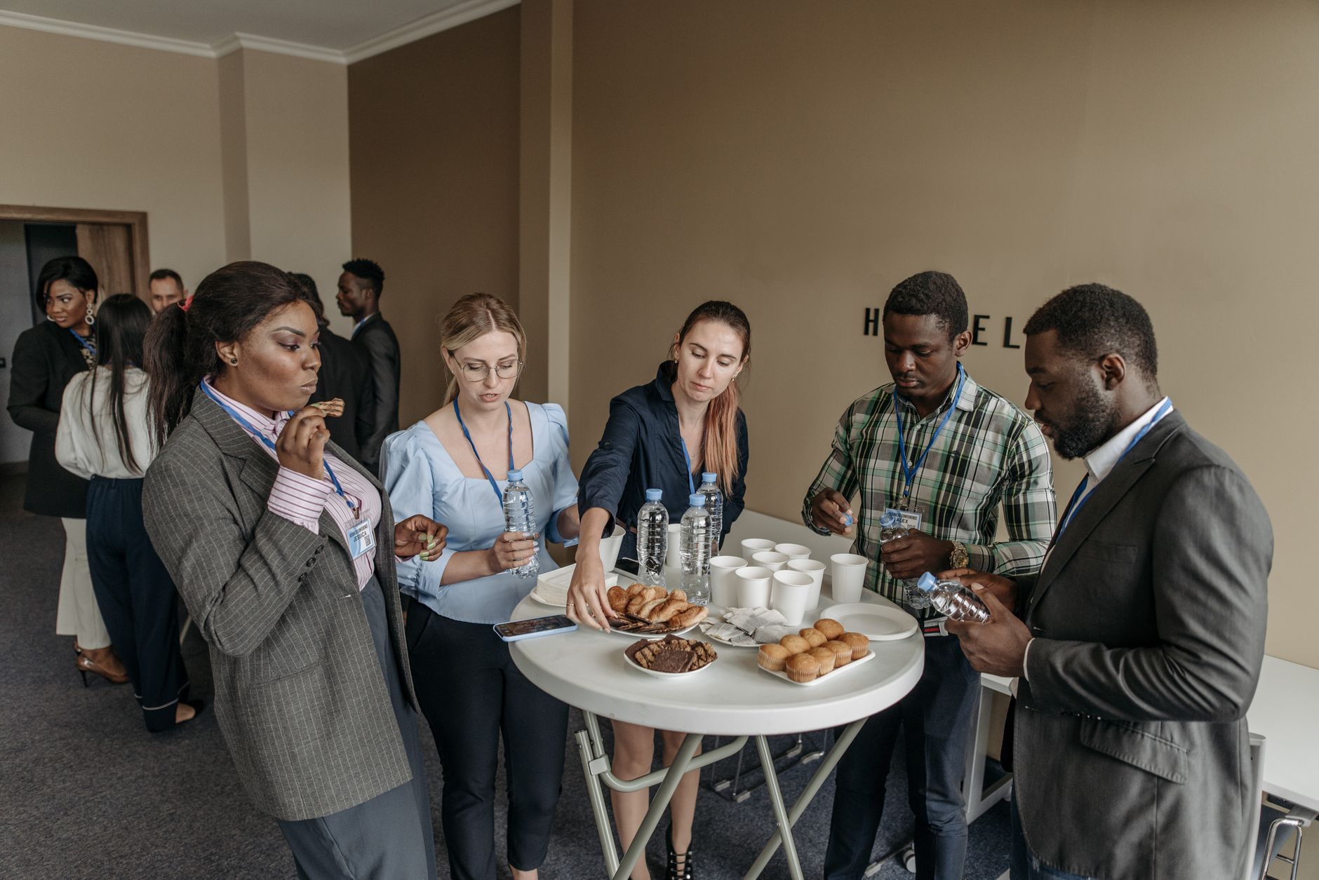 Diverse team enjoying espresso drinks during collaborative work session in Philadelphia office