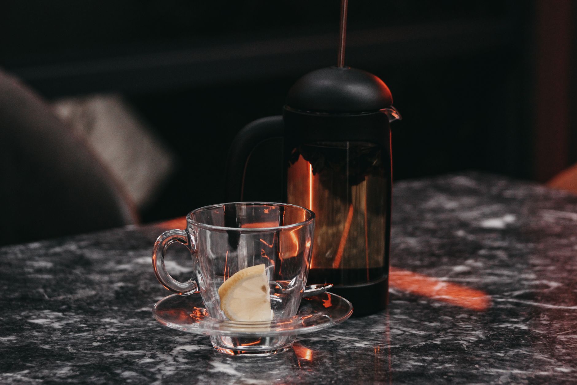 Professional-grade stainless steel French press in a busy restaurant kitchen