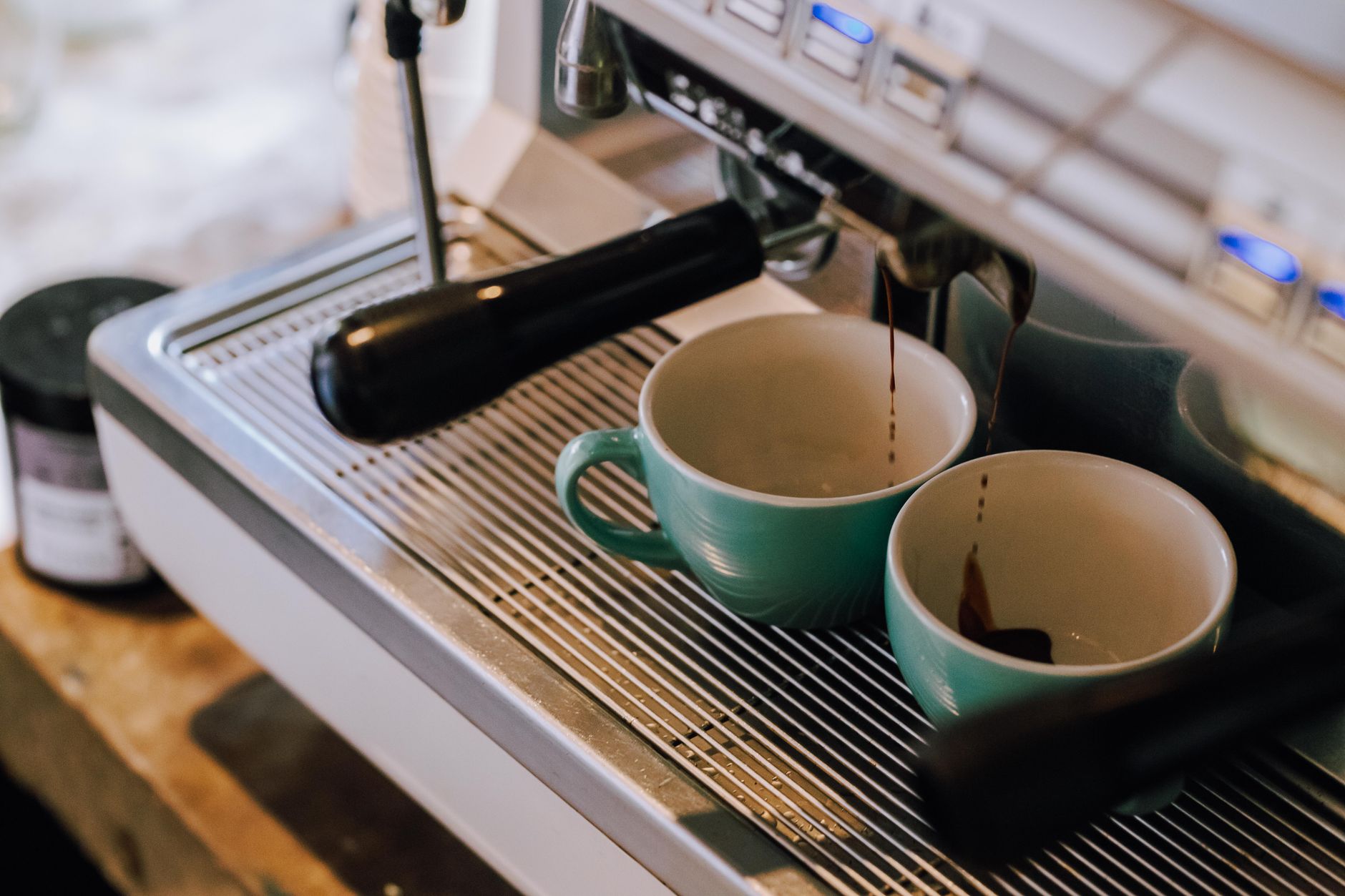 Technician performing preventative maintenance on hotel coffee machine