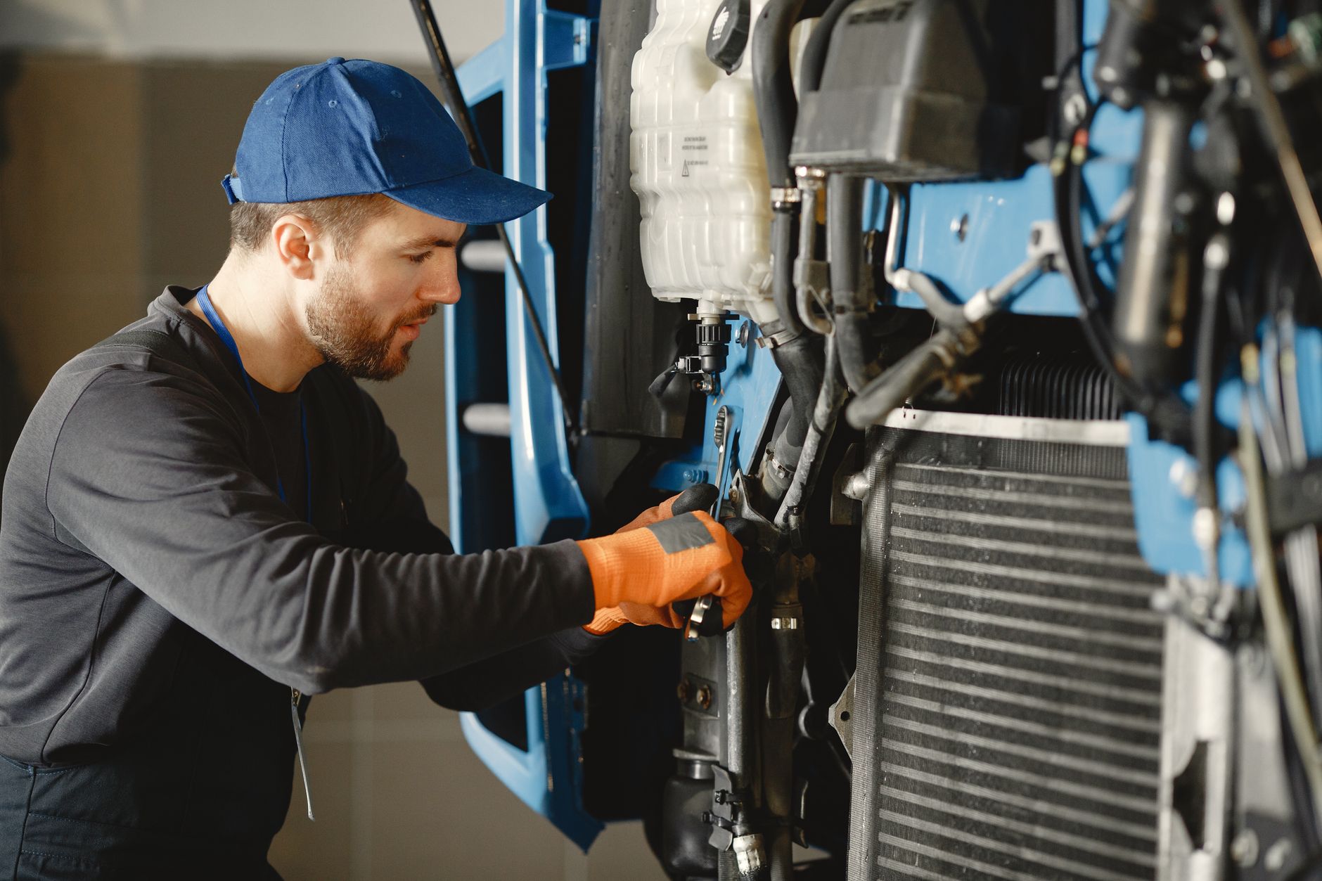 Certified technician performing routine maintenance on commercial coffee equipment
