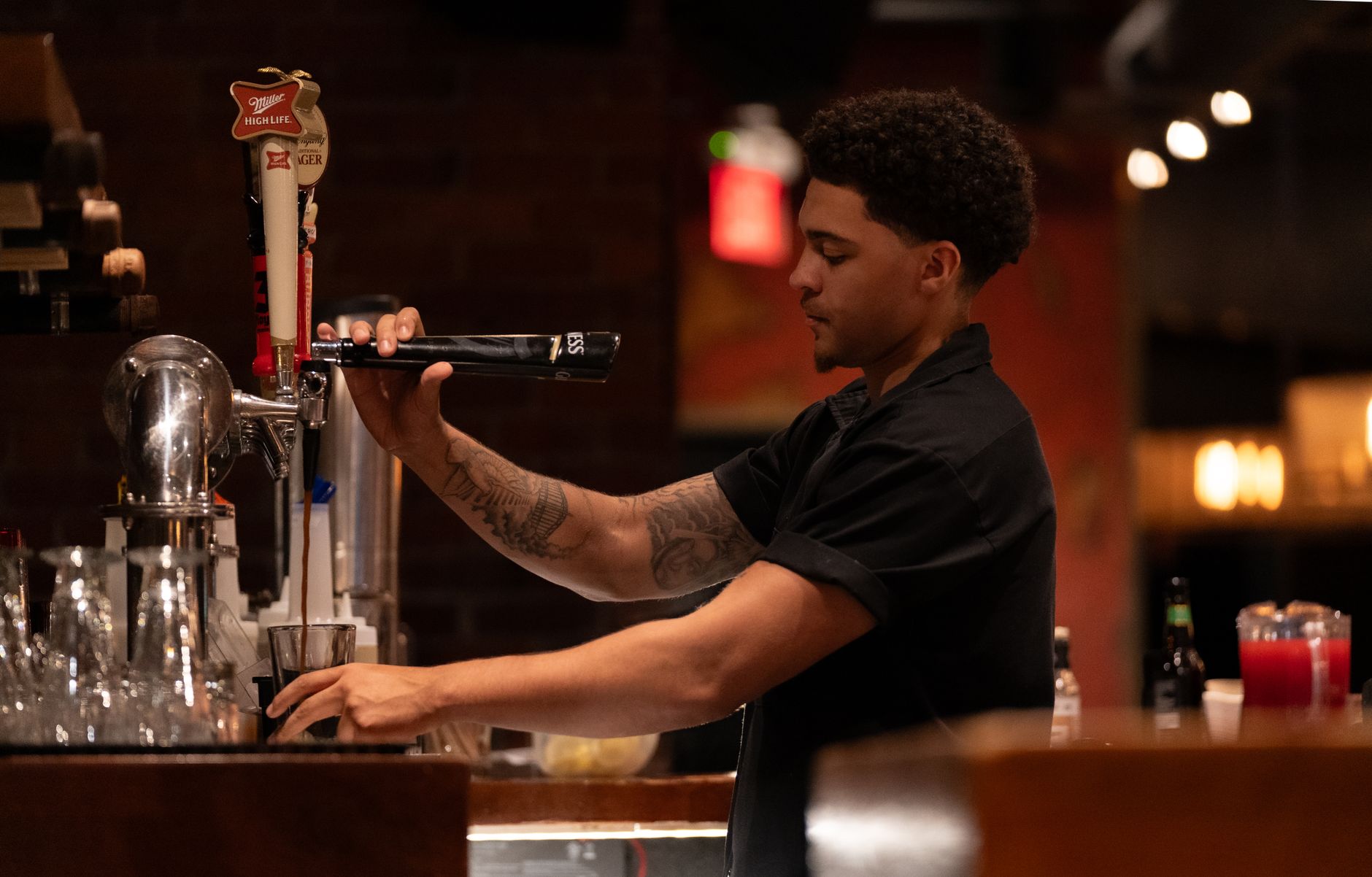 Certified coffee technician performing maintenance on a commercial machine