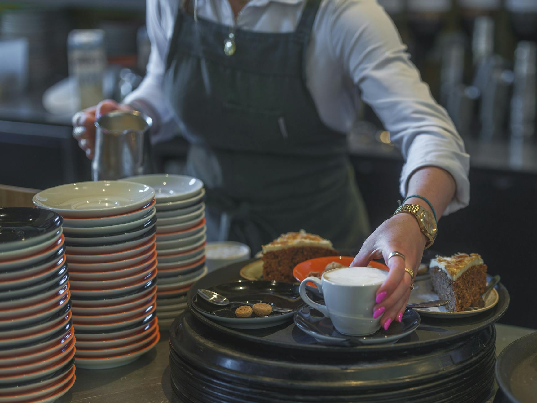 Professional barista serving coffee in Spartanburg restaurant