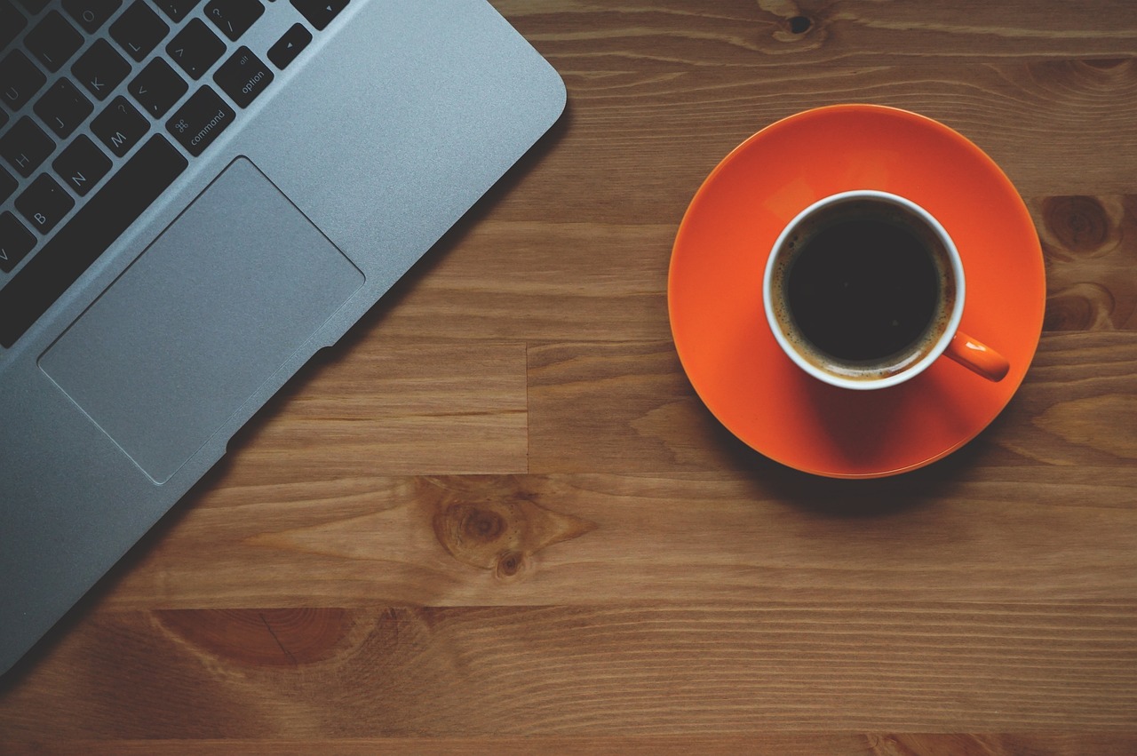 Compact espresso machine on a modern home office desk