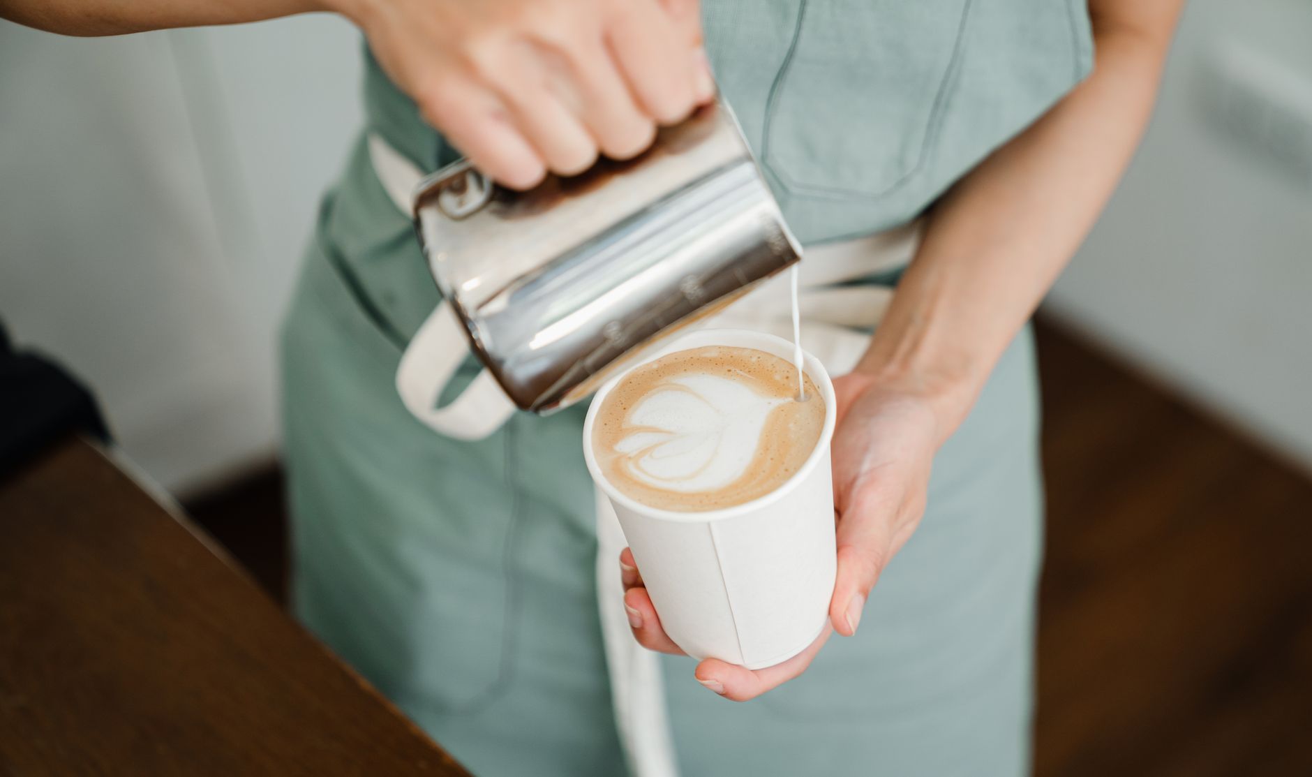 Professional barista training hotel staff on craft coffee techniques