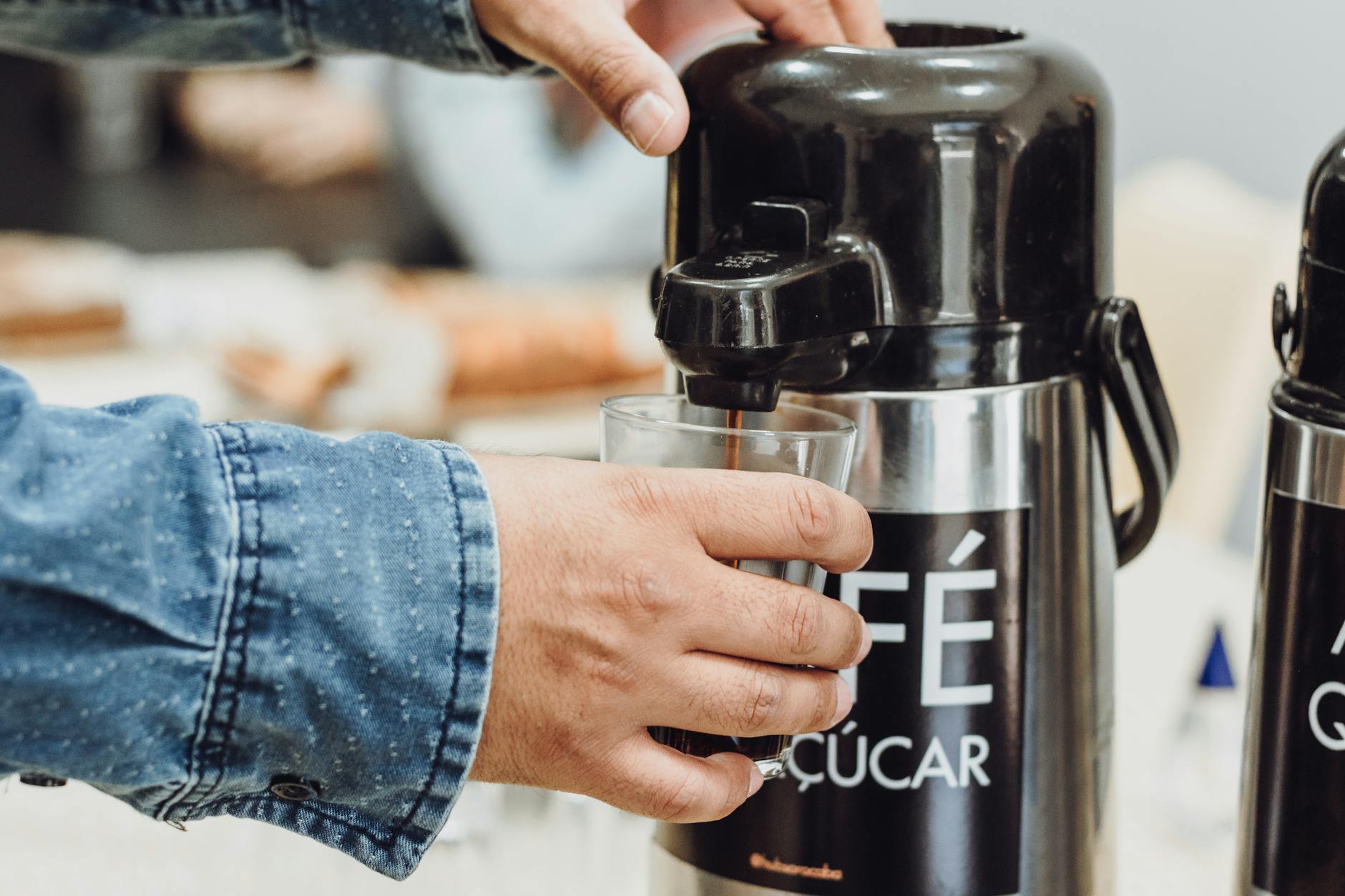 Modern automated coffee machine in busy office