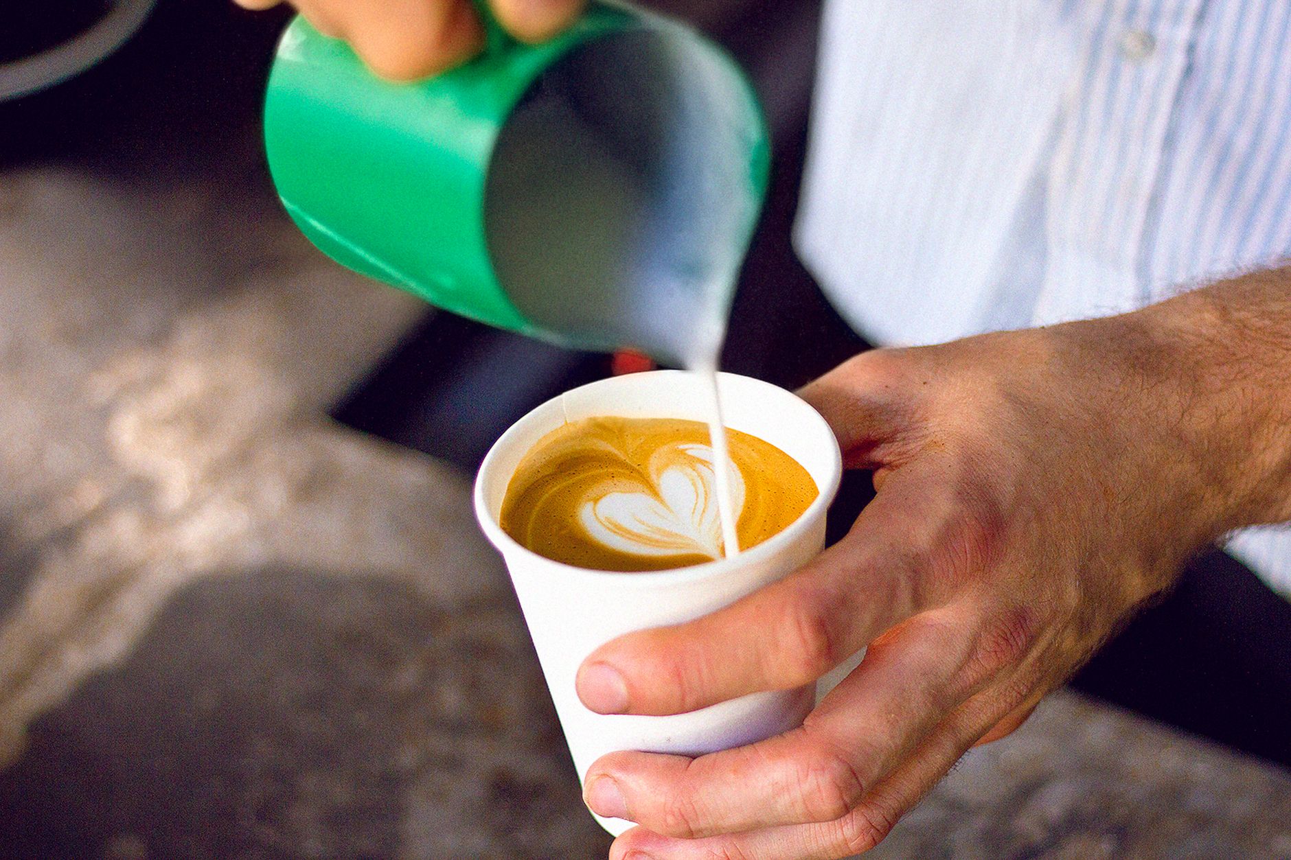 Barista preparing specialty coffee in commercial setting