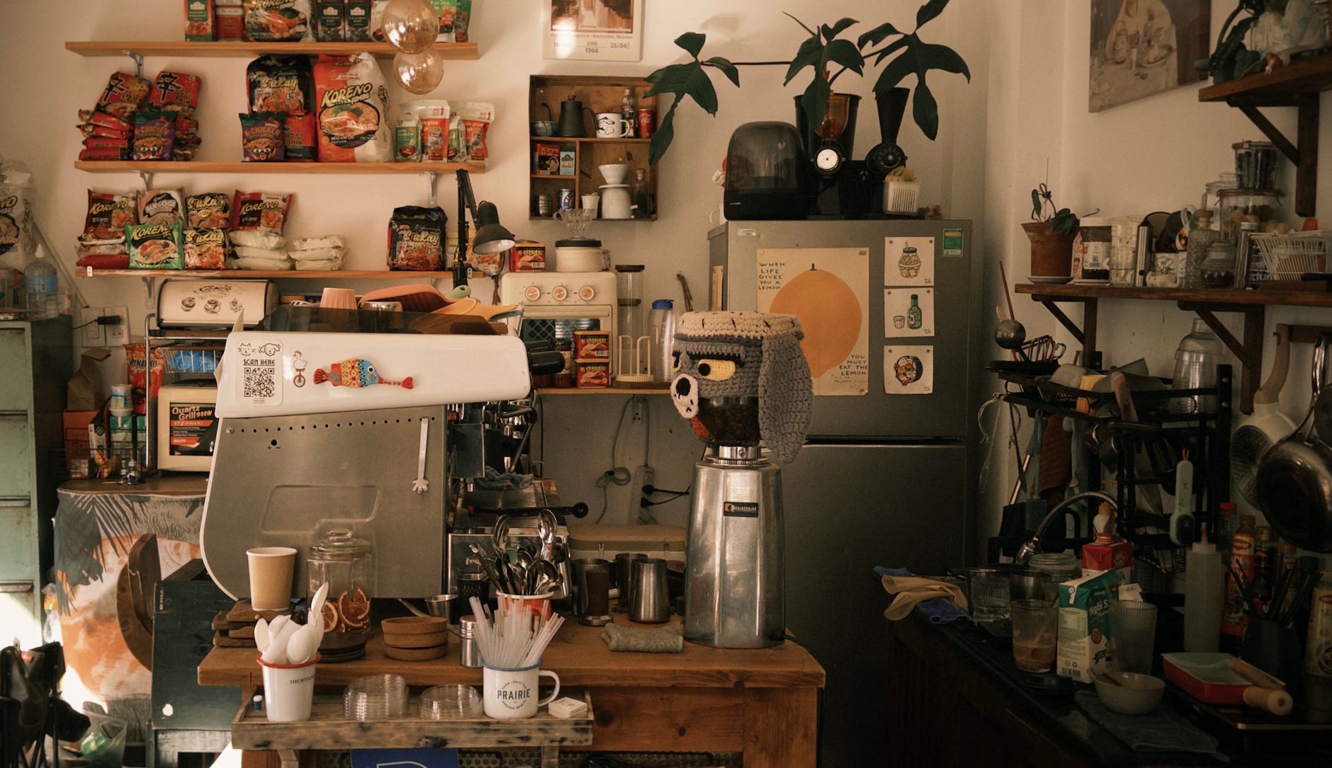 Technician performing routine maintenance on commercial espresso equipment