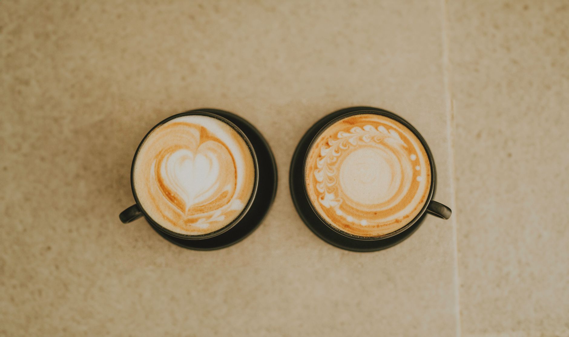 Restaurant menu board showcasing premium latte art options with pricing tiers