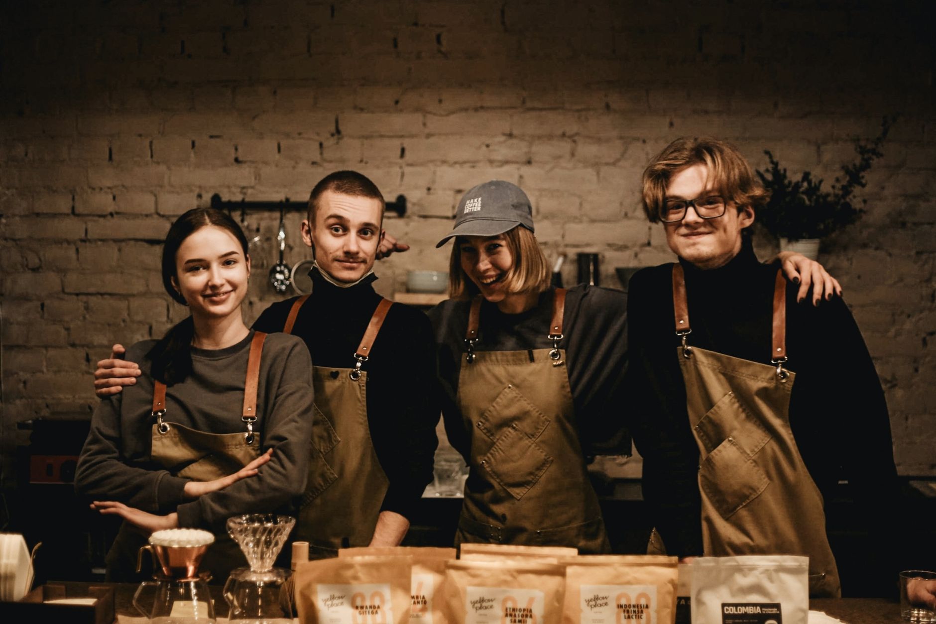 Professional barista conducting staff training at a commercial coffee machine