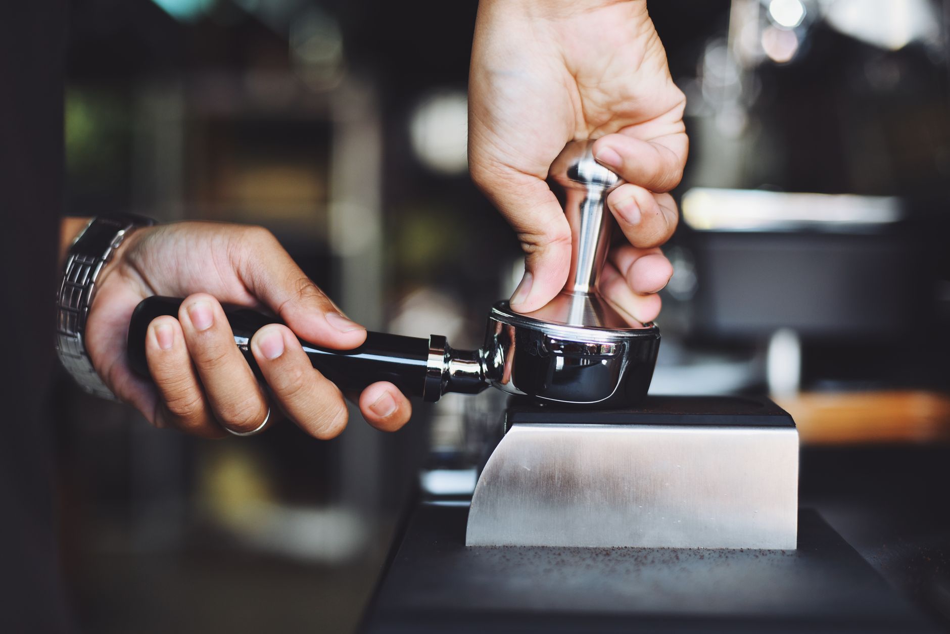 Technician repairing commercial espresso machine in Boston
