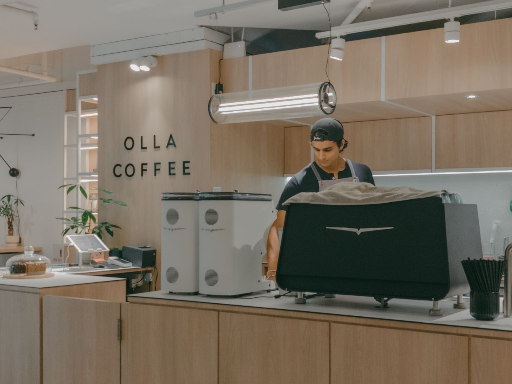 Professional barista using a precision scale to measure espresso dose