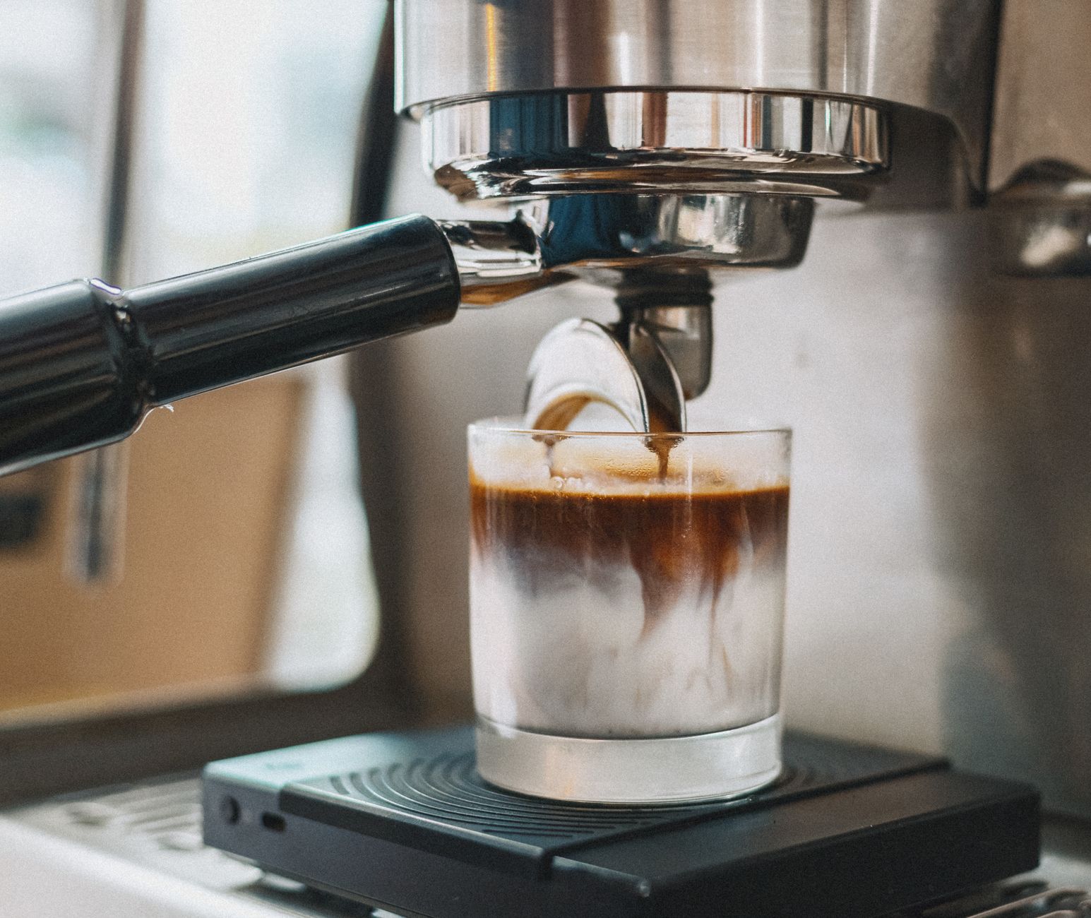 Modern automatic latte art machine creating designs