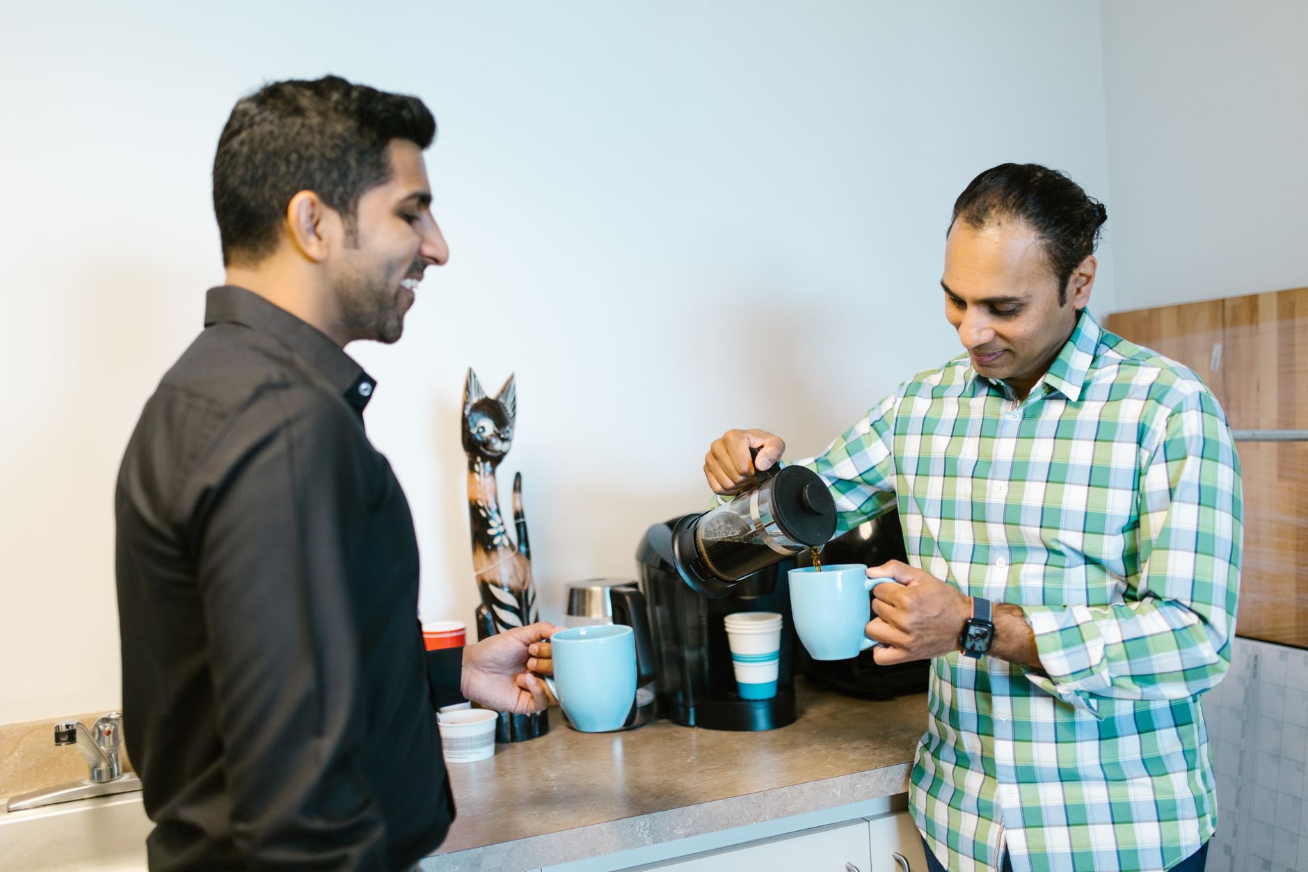 Modern office breakroom with coffee station in San Antonio