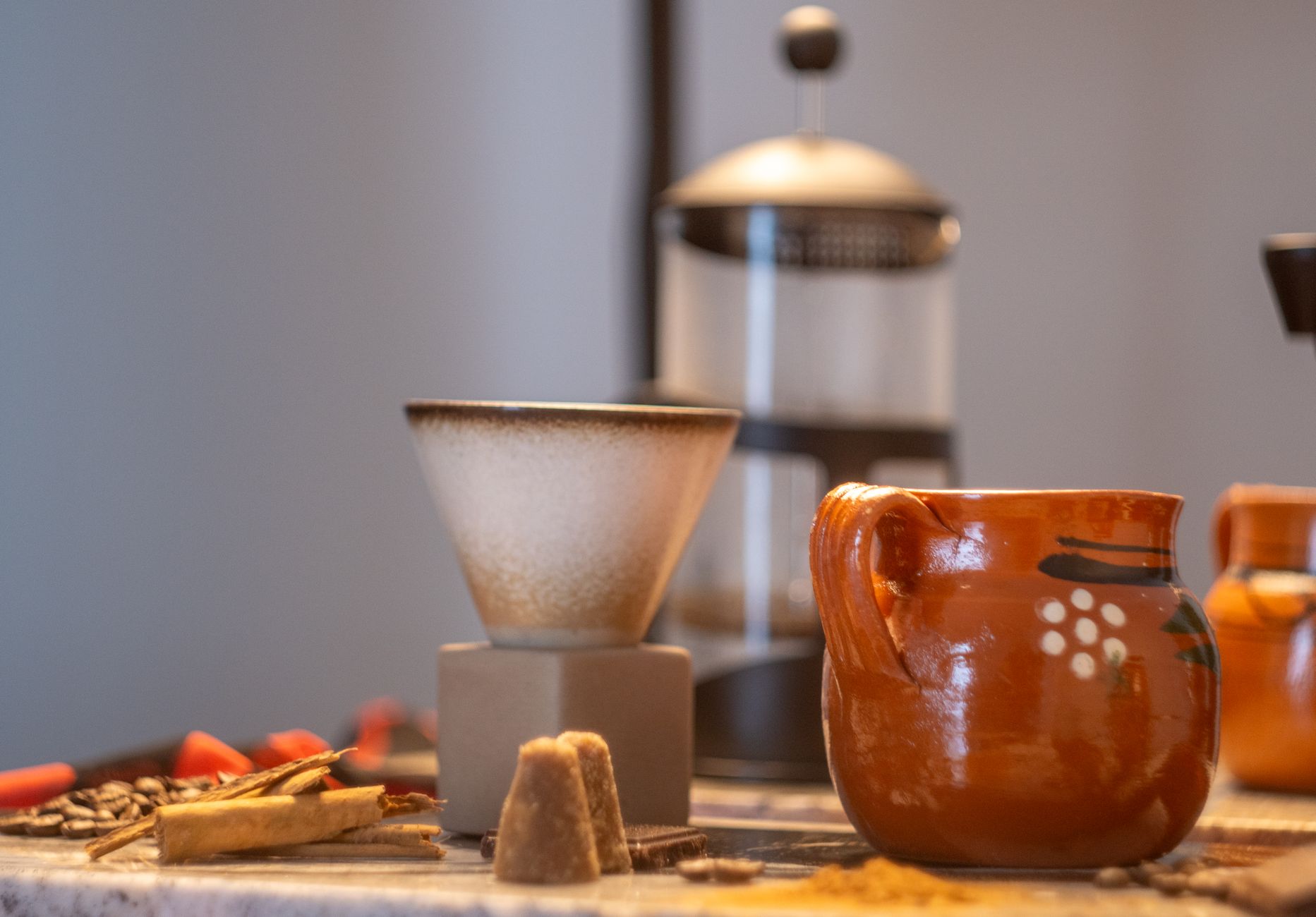 Artistic presentation of french press coffee with seasonal garnishes