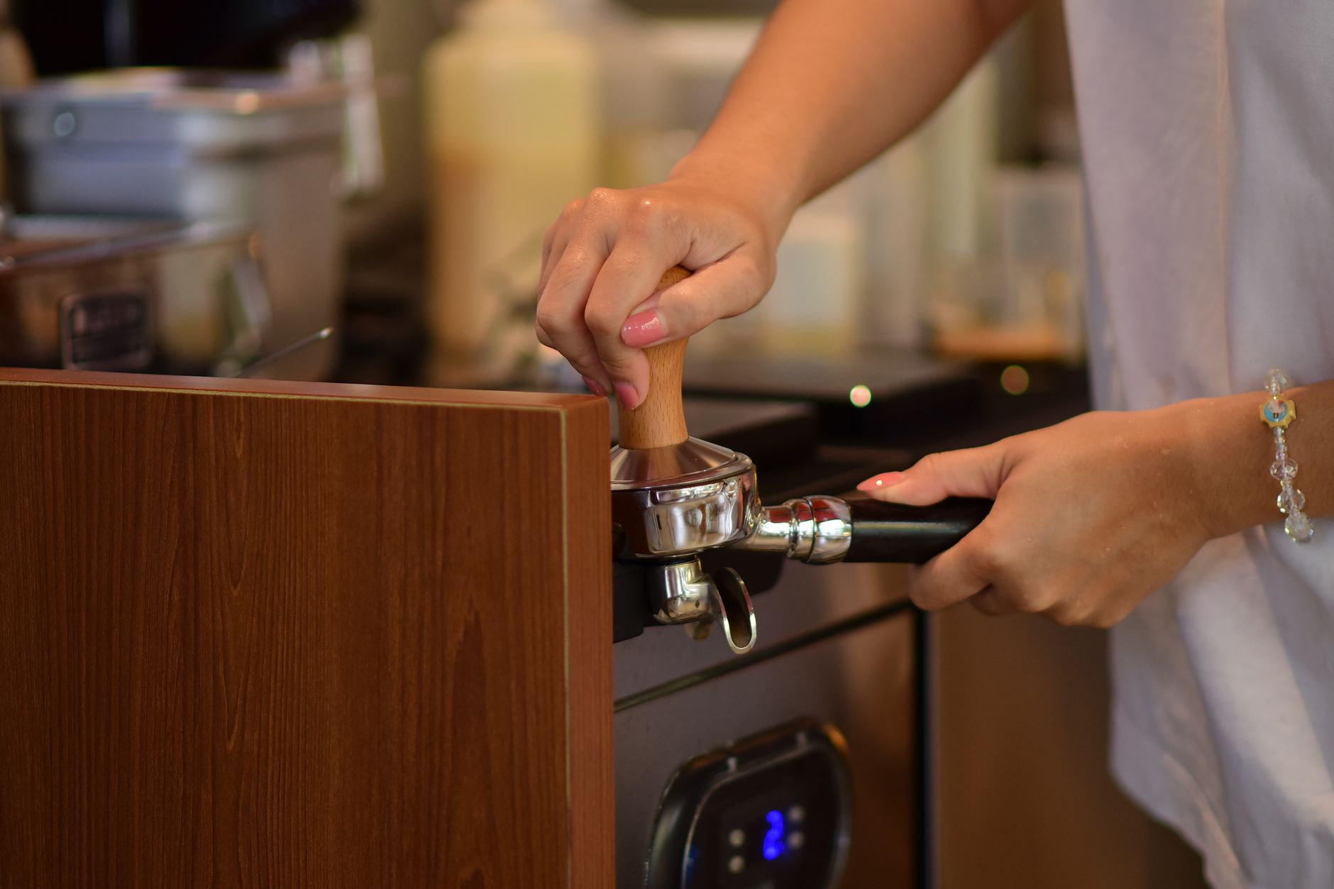Professional barista skillfully preparing espresso drinks