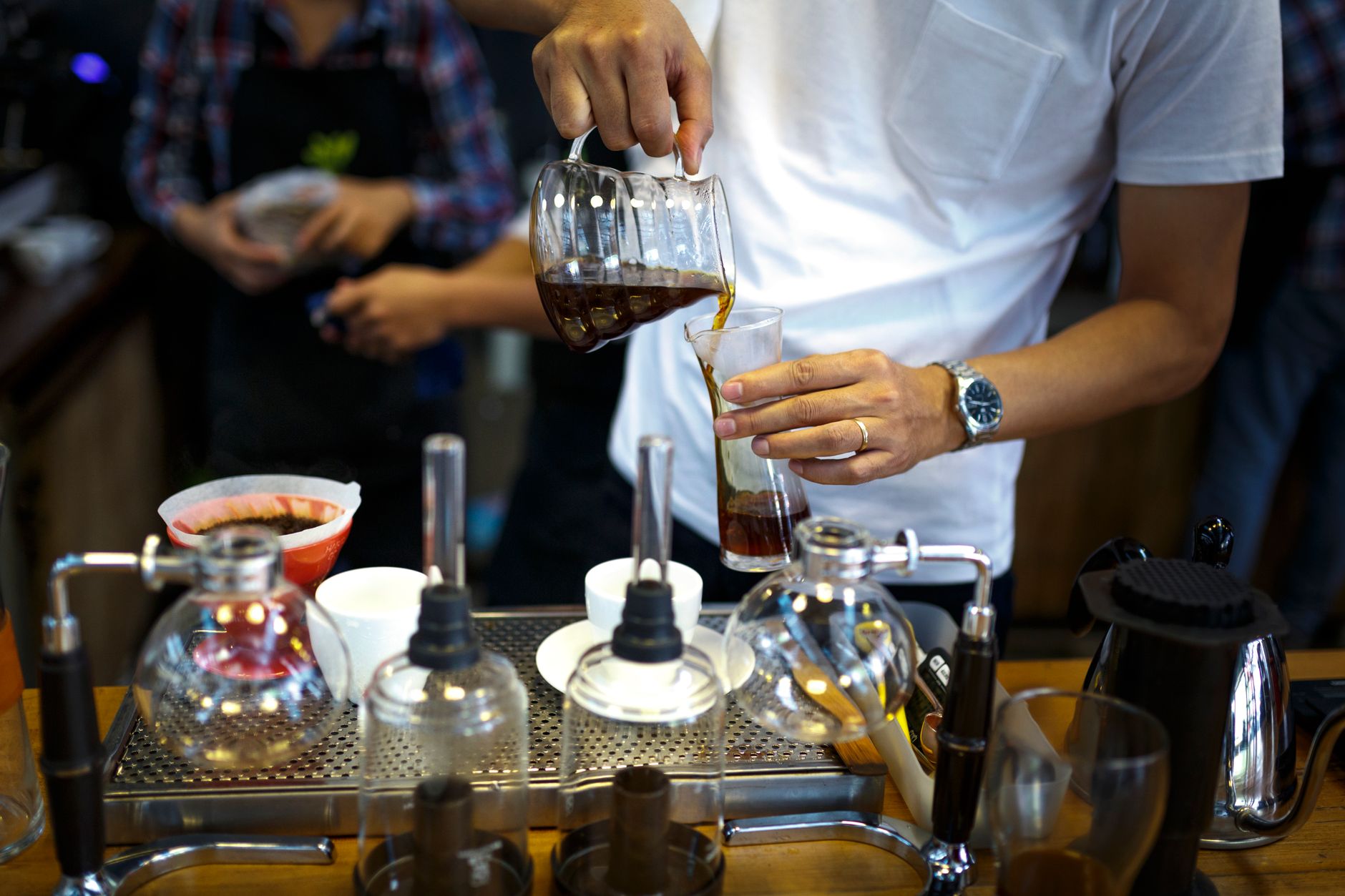 Busy office workers pouring coffee in a Virginia Beach office break room