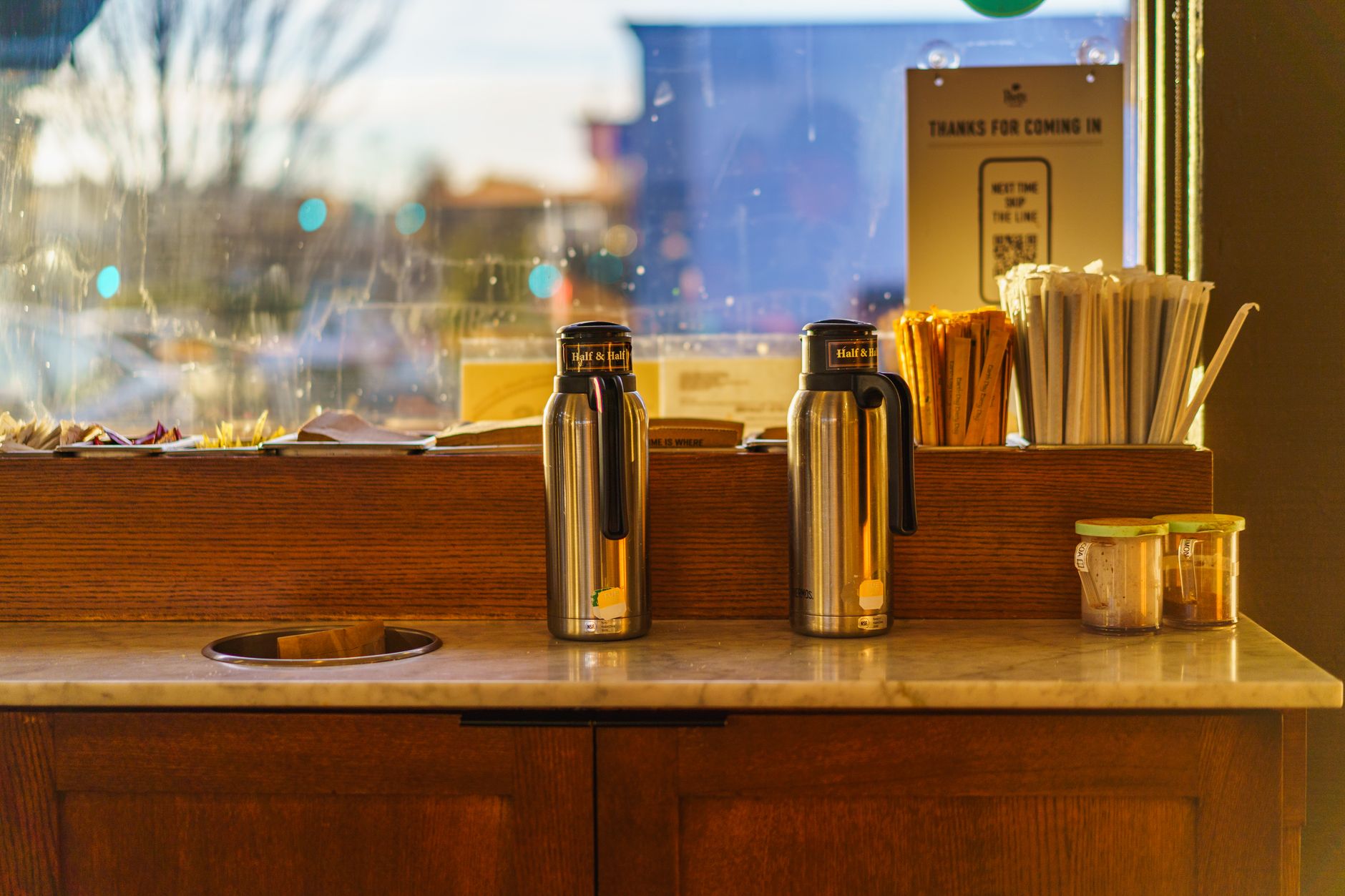 Close-up of stainless steel reusable coffee filter in an office coffee maker