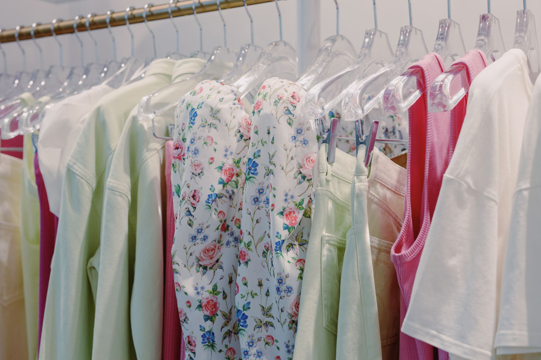 Vibrant selection of clothes on display in a modern boutique, showcasing fashion trends.