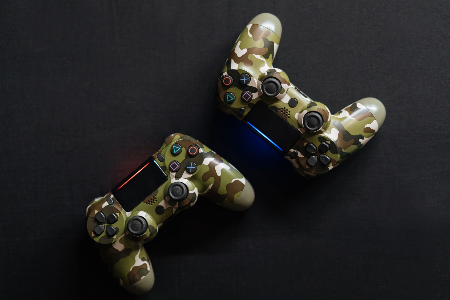 Close-up of two camouflage game controllers, perfect for gaming enthusiasts.
