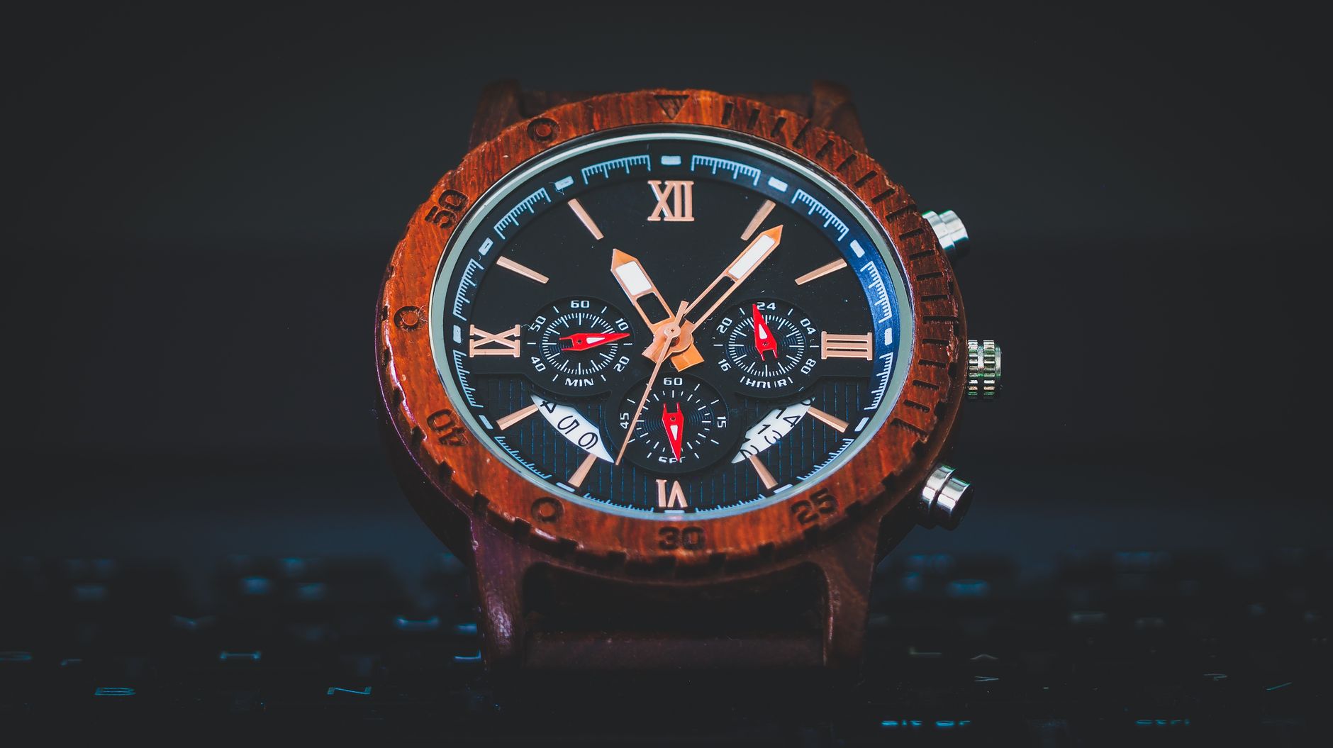 Close-up of a stylish wooden chronograph watch showcasing detailed craftsmanship and design.
