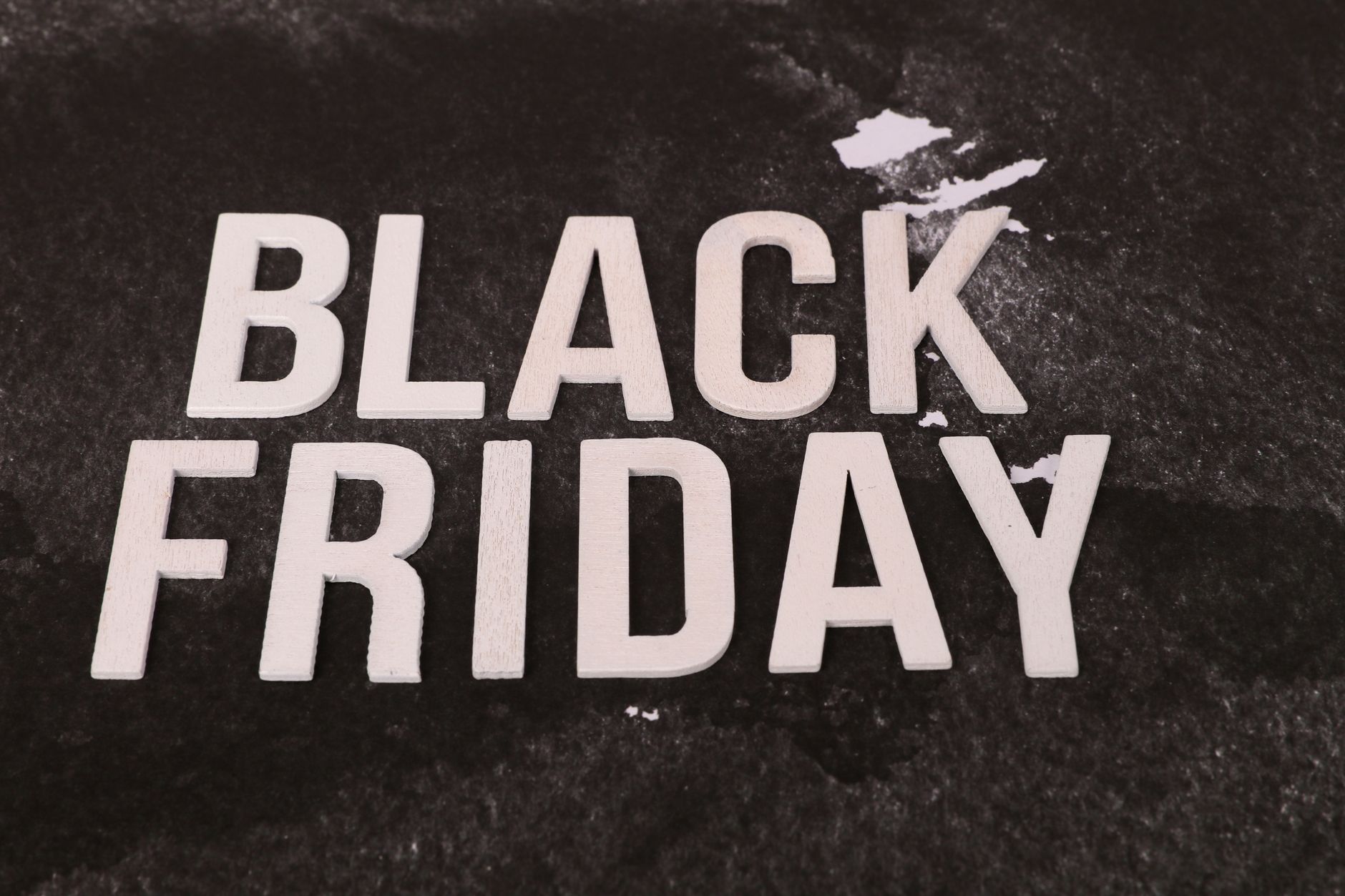 Bold 'Black Friday' text on a textured dark background, ideal for promotions.