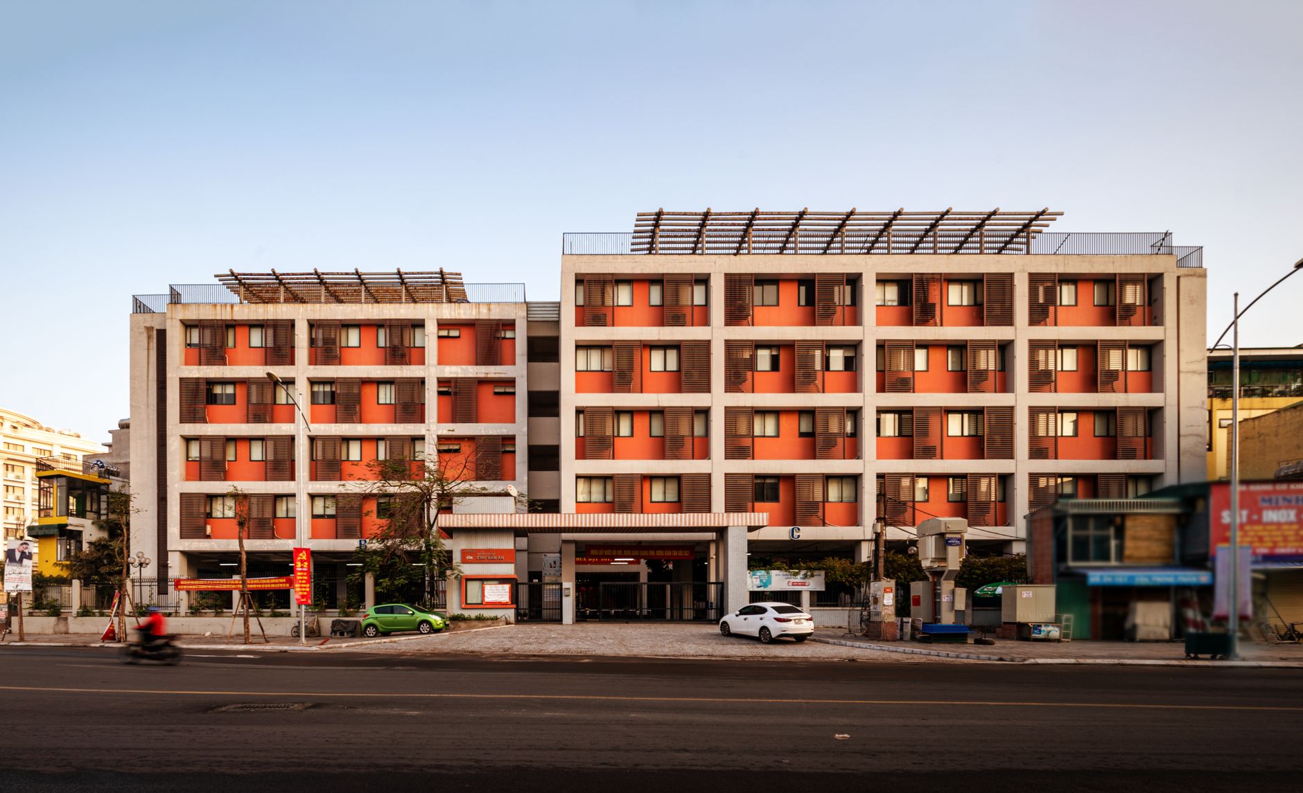 A contemporary apartment building facade in Hà Nội, Vietnam, during the day.