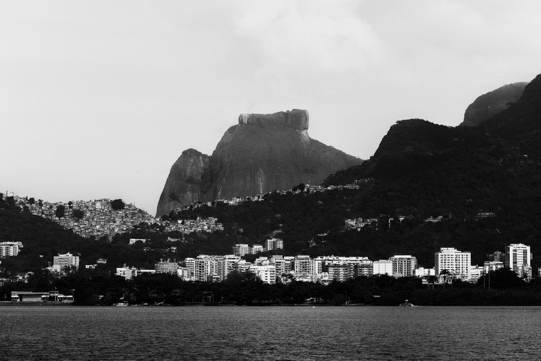 Dramatic black and white landscape of Rio de Janeiro skyline with mountains.