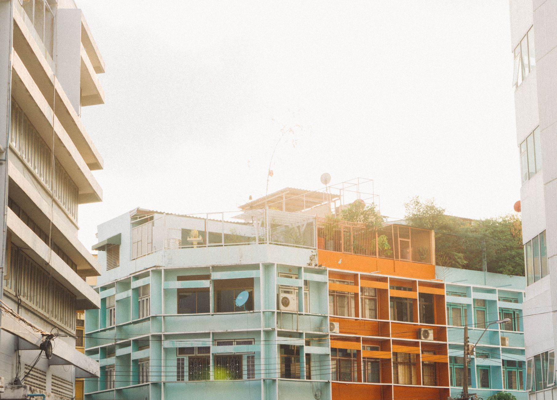 Vibrant cityscape of contemporary architecture in Bangkok, showcasing colorful residential buildings.