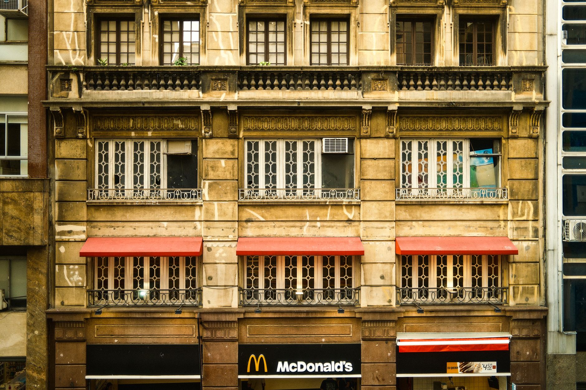 Ornate historic building facade with McDonald's signage in downtown São Paulo.