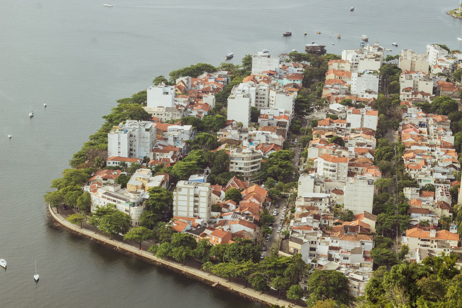 Aerial view of Lagoa neighborhood, showcasing urban landscape next to the water in Rio de Janeiro, Brazil.